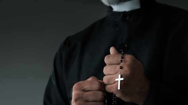 priest grabs girl's hair