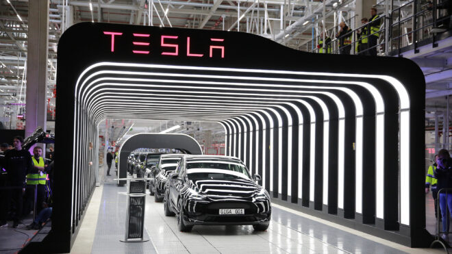 Newly completed Tesla electric cars at the official opening of the new Tesla electric car manufacturing plant on March 22, 2022 near Gruenheide, Germany. (Christian Marquardt/Getty Images/TNS)