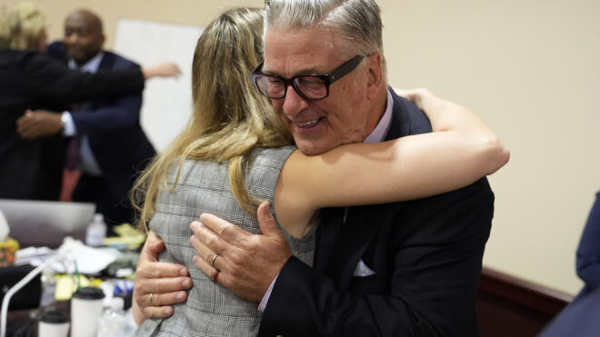 Alec Baldwin hugs a member of his legal team at the conclusion of his trial on involuntary manslaughter, at Santa Fe County District Court on July 12, 2024, in Santa Fe, New Mexico. (Ramsay de Give/Pool/AFP/Getty Images/TNS)