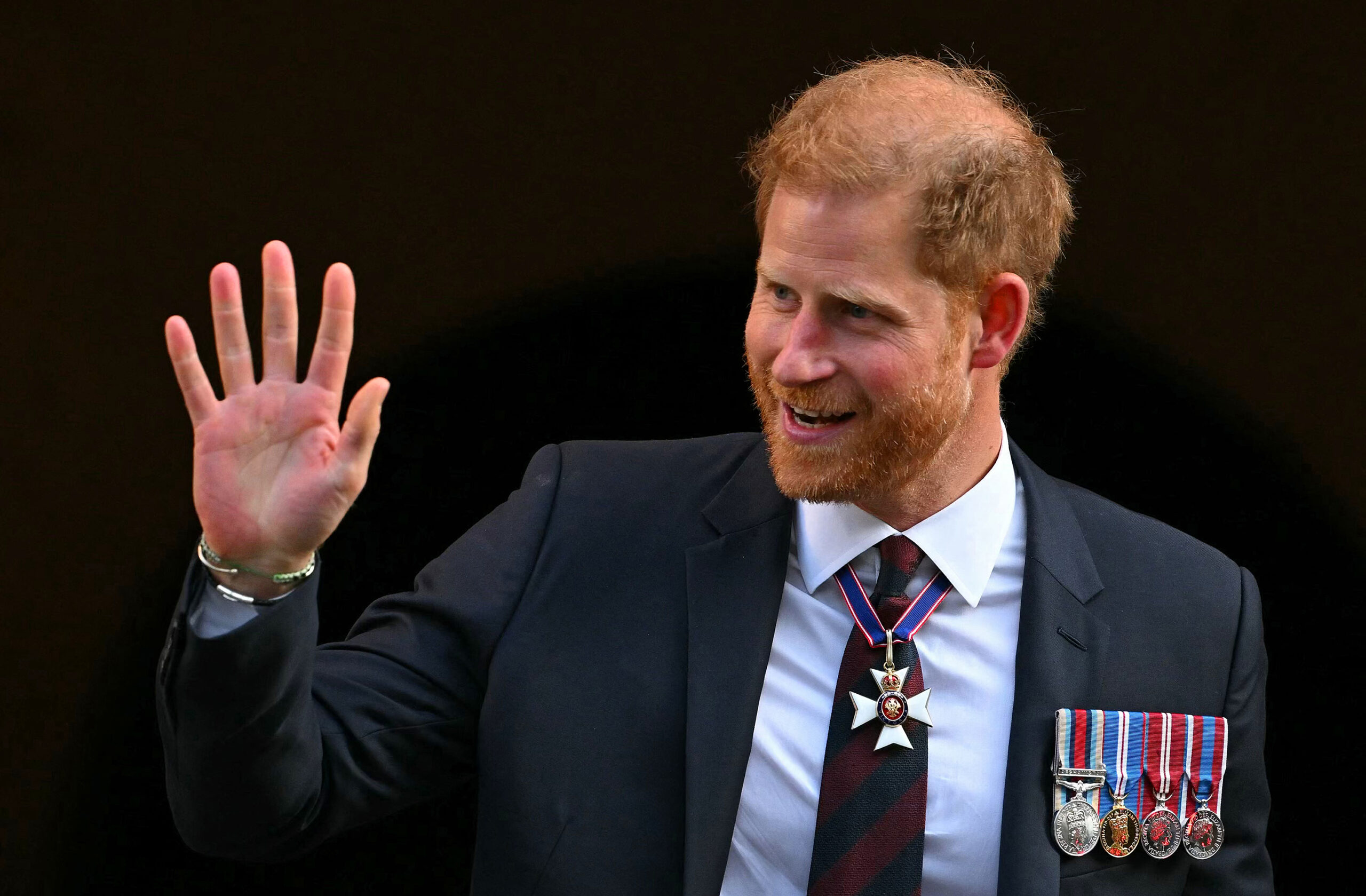 Britain's Prince Harry, Duke of Sussex waves as he leaves after attending a ceremony marking the 10th anniversary of the Invictus Games, at St Paul's Cathedral in London on May 8, 2024. (Justin Tallis/AFP/Getty Images/TNS)