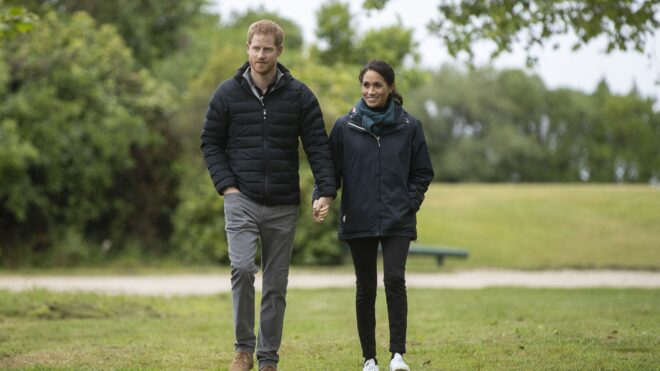 Britain's Prince Harry and his wife Meghan, Duchess of Sussex visit Totaranui Campground in the Abel Tasman National Park on October 29, 2018. - Prince Harry passed on greetings from "our little bump" to conservation workers in New Zealand on October 29 when he and pregnant wife Meghan toured a South Island nature reserve. (Photo by ROBERT KITCHIN / POOL / AFP) (Photo by ROBERT KITCHIN/POOL/AFP via Getty Images)