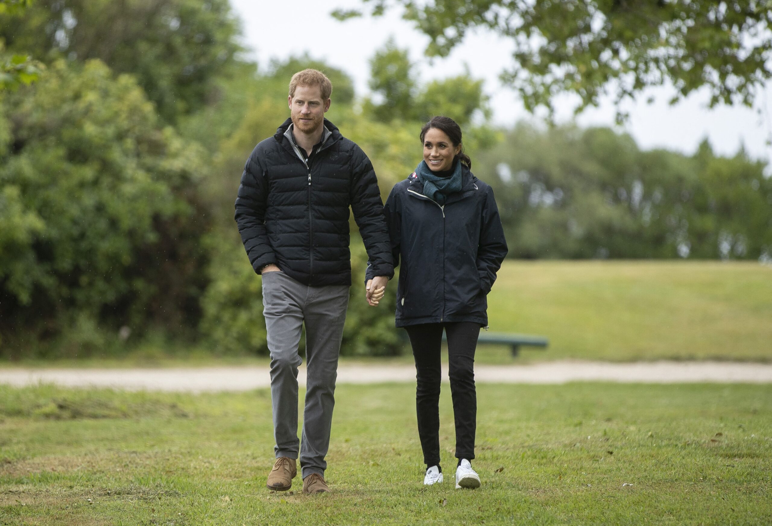 Britain's Prince Harry and his wife Meghan, Duchess of Sussex visit Totaranui Campground in the Abel Tasman National Park on October 29, 2018. - Prince Harry passed on greetings from "our little bump" to conservation workers in New Zealand on October 29 when he and pregnant wife Meghan toured a South Island nature reserve. (Photo by ROBERT KITCHIN / POOL / AFP) (Photo by ROBERT KITCHIN/POOL/AFP via Getty Images)