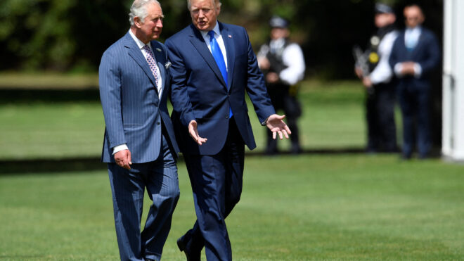 US President Donald Trump (R) walks with Britain's Prince Charles, Prince of Wales (L) as he arrives for a welcome ceremony at Buckingham Palace in central London on June 3, 2019, on the first day of the US president and First Lady's three-day State Visit to the UK. Britain rolled out the red carpet for US President Donald Trump on June 3 as he arrived in Britain for a state visit already overshadowed by his outspoken remarks on Brexit. (Photo by TOBY MELVILLE / POOL / AFP) (Photo by TOBY MELVILLE/POOL/AFP via Getty Images)