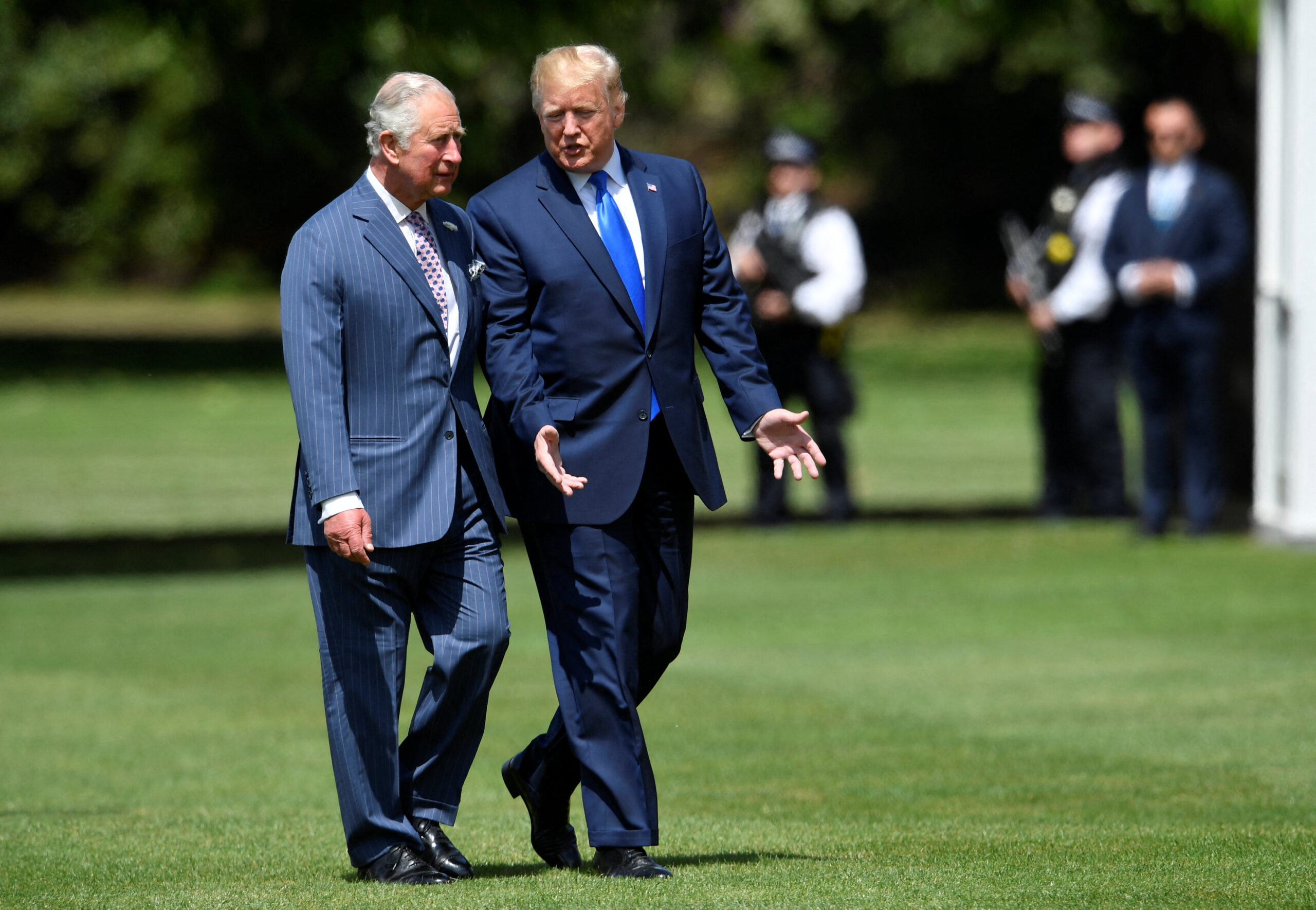 US President Donald Trump (R) walks with Britain's Prince Charles, Prince of Wales (L) as he arrives for a welcome ceremony at Buckingham Palace in central London on June 3, 2019, on the first day of the US president and First Lady's three-day State Visit to the UK. Britain rolled out the red carpet for US President Donald Trump on June 3 as he arrived in Britain for a state visit already overshadowed by his outspoken remarks on Brexit. (Photo by TOBY MELVILLE / POOL / AFP) (Photo by TOBY MELVILLE/POOL/AFP via Getty Images)