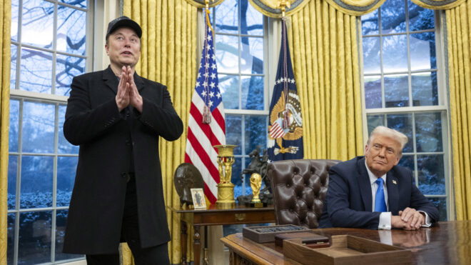 Elon Musk speaks as US President Donald Trump looks on in the Oval Office of the White House in Washington, DC, on February 11, 2025. Tech billionaire Elon Musk, who has been tapped by President Donald Trump to lead federal cost-cutting efforts, said the United States would go "bankrupt" without budget cuts. Musk leads the efforts under the newly created Department of Government Efficiency (DOGE), and was speaking at the White House with Trump, who has in recent weeks unleashed a flurry of orders aimed at slashing federal spending. (Photo by Jim WATSON / AFP) (Photo by JIM WATSON/AFP via Getty Images)