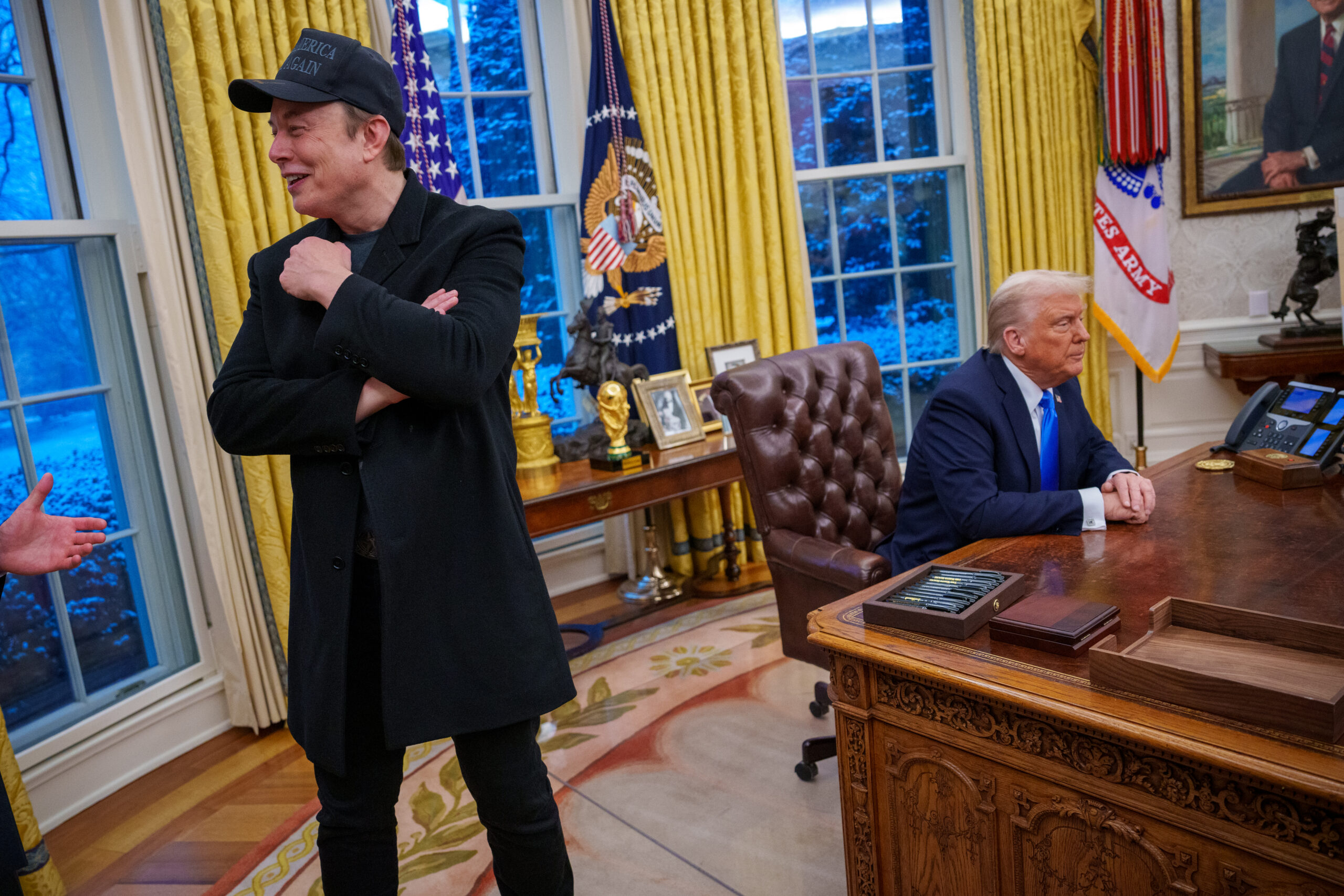 WASHINGTON, DC - FEBRUARY 11: Tesla and SpaceX CEO Elon Musk and U.S. President Donald Trump appear during an executive order signing in the Oval Office at the White House on February 11, 2025 in Washington, DC. Trump is to sign an executive order implementing the Department of Government Efficiency's (DOGE) "workforce optimization initiative," which, according to Trump, will encourage agencies to limit hiring and reduce the size of the federal government. (Photo by Andrew Harnik/Getty Images)