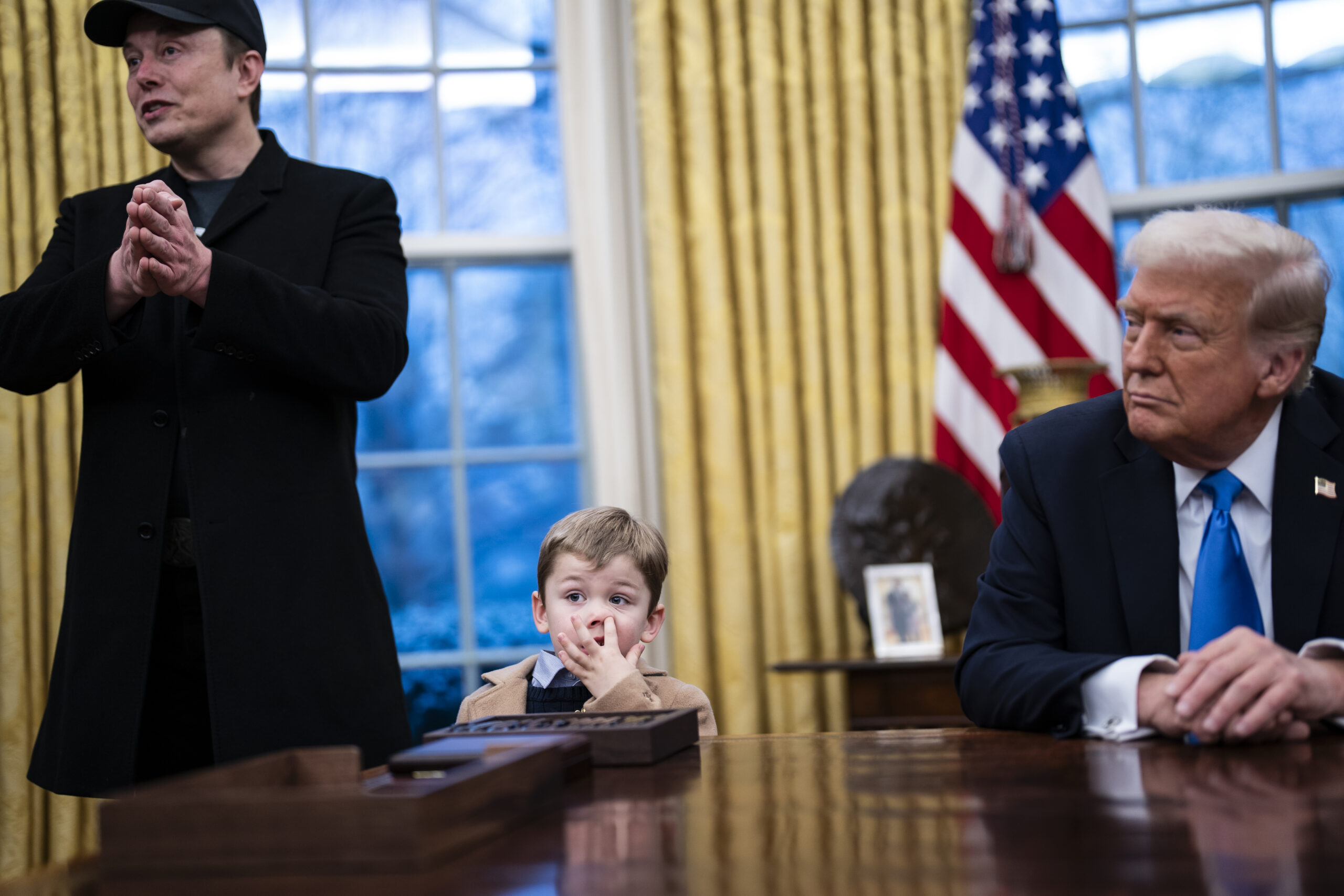 Washington, DC - February 11 : Elon Musk, with his son X Æ A-Xii, speaks with President Donald J Trump and reporters in the Oval Office at the White House on Tuesday, Feb 11, 2025 in Washington, DC. (Photo by Jabin Botsford/The Washington Post via Getty Images)