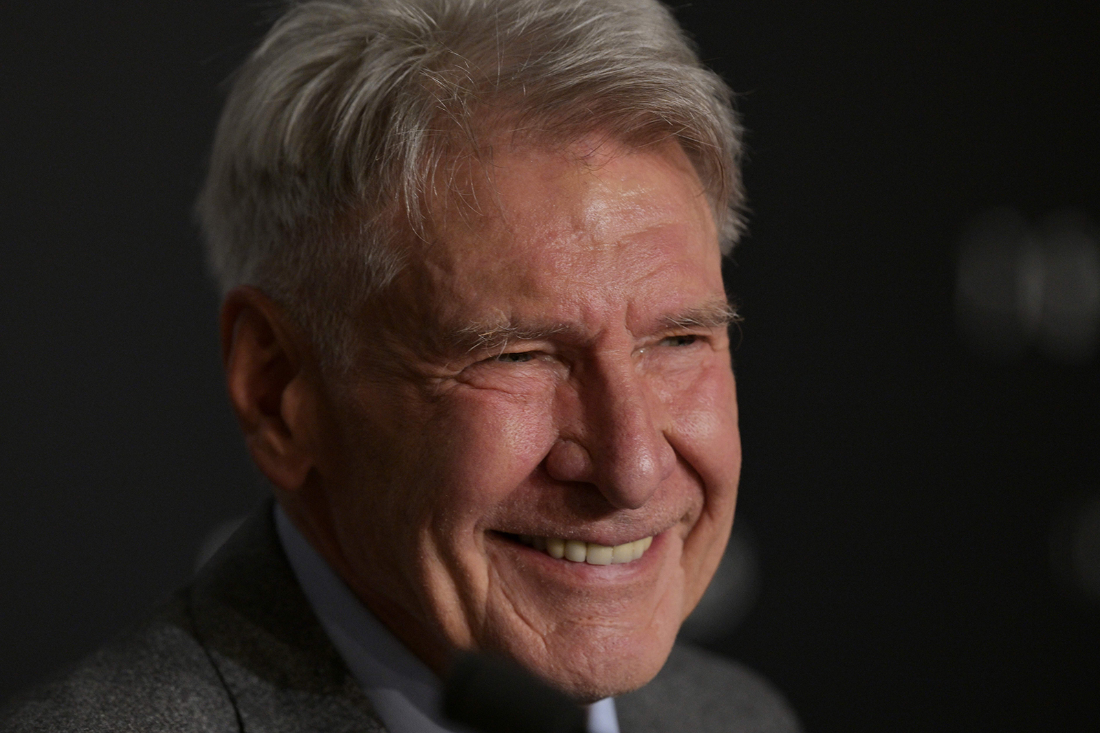 Harrison Ford smiles during a press conference for the film "Indiana Jones and the Dial of Destiny" at the 76th annual Cannes Film Festival in Cannes, France, on May 19, 2023. (Stefano Rellandini/AFP via Getty Images/TNS)