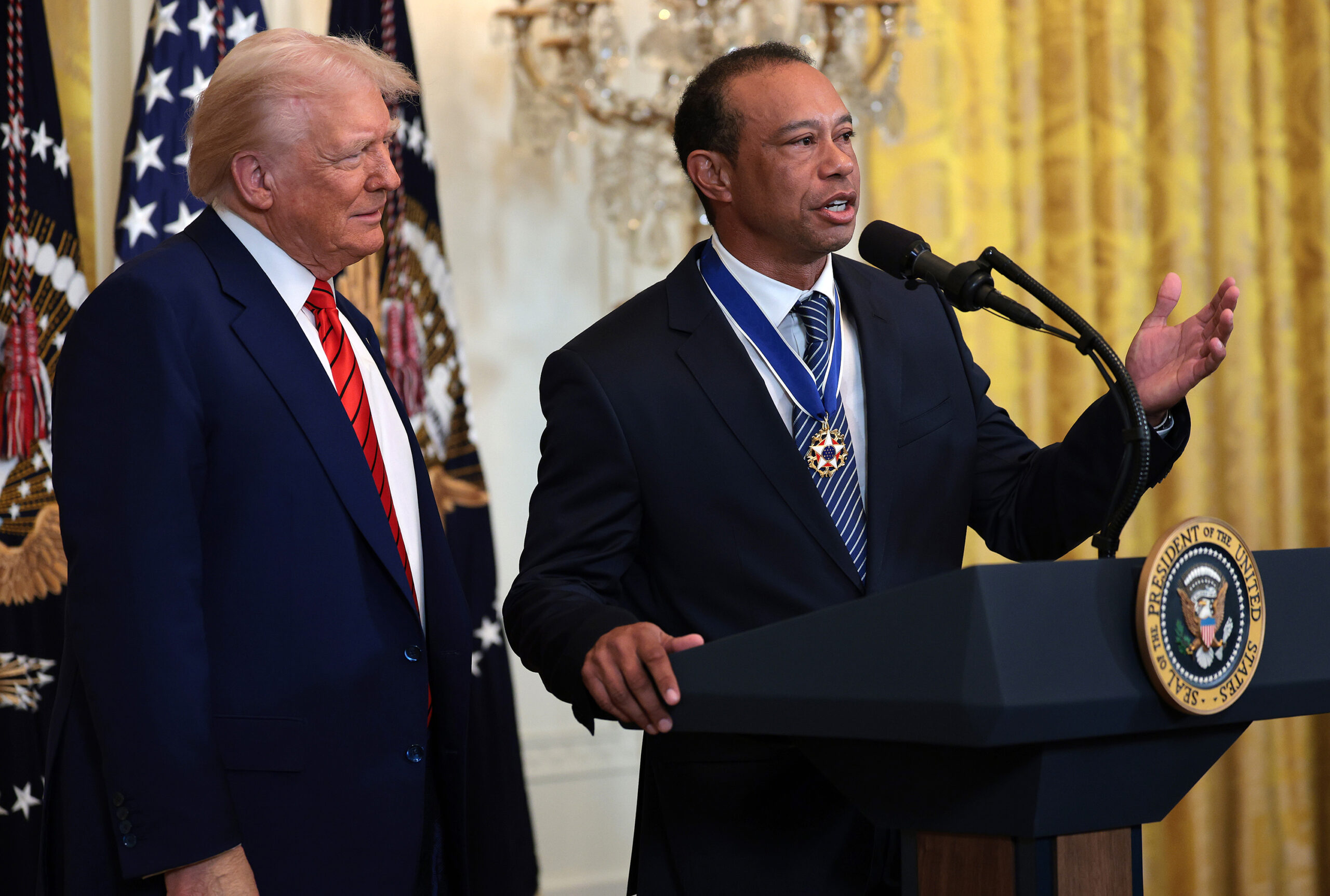 Gold legend Tiger Woods speaks alongside U.S. President Donald Trump during a reception honoring Black History Month in the East Room of the White House on Feb. 20, 2025, in Washington, D.C. (Win McNamee/Getty Images/TNS)