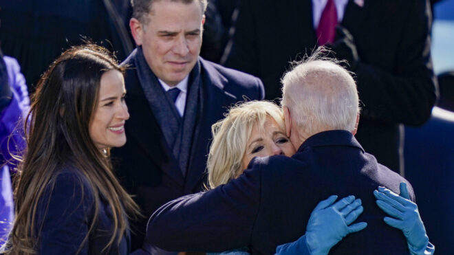 WASHINGTON, DC - JANUARY 20: U.S. President Joe Biden embraces his family First Lady Dr. Jill Biden, son Hunter Biden and daughter Ashley after being sworn in during his inauguation on the West Front of the U.S. Capitol on January 20, 2021 in Washington, DC. During today's inauguration ceremony Joe Biden becomes the 46th president of the United States. (Photo by Drew Angerer/Getty Images)