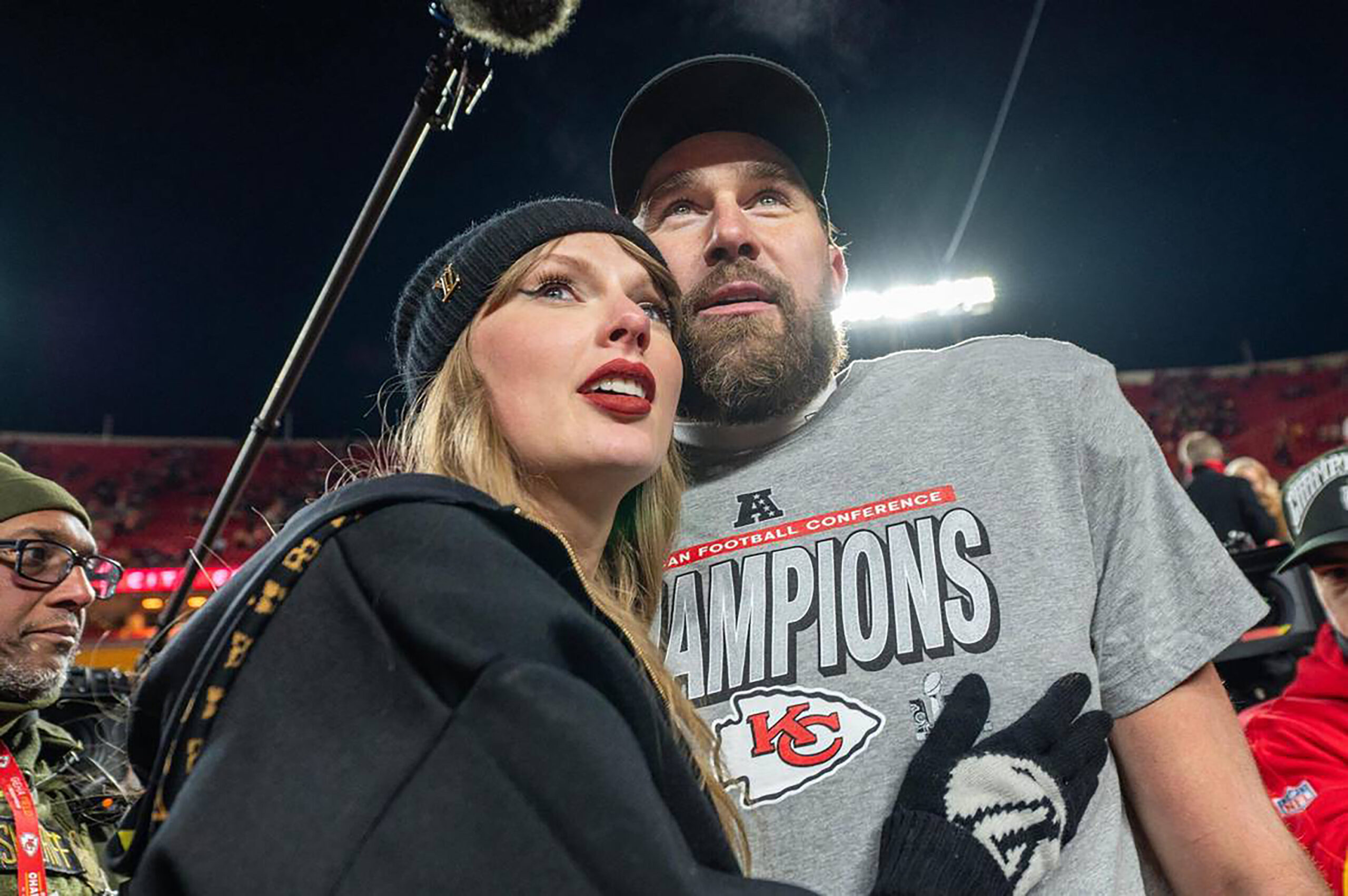 Taylor Swift, left, and Kansas City Chiefs tight end Travis Kelce walk off the field after the trophy ceremony following the Chiefs' 32-29 victory over the Buffalo Bills in the AFC Championship Game on Jan. 26, 2025, at GEHA Field at Arrowhead Stadium in Kansas City, Missouri. (Emily Curiel/Kansas City Star/Tribune News Service via Getty Images)