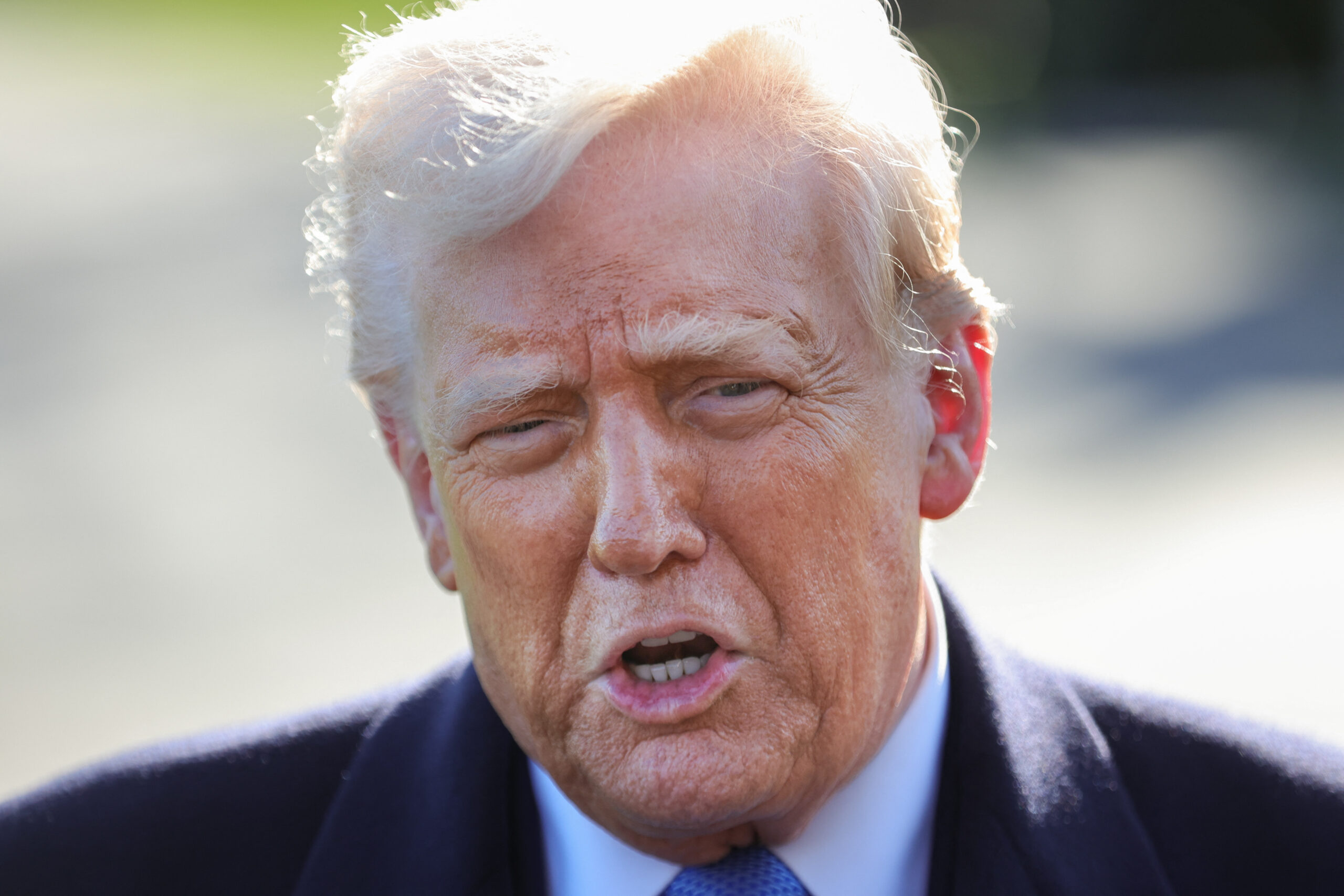 U.S. President Donald Trump speaks to reporters at the White House in Washington, D.C. on March 21, 2025 before boarding Marine One en route to Morristown, New Jersey. (Photo by Bryan Dozier / Middle East Images / Middle East Images via AFP) (Photo by BRYAN DOZIER/Middle East Images/AFP via Getty Images)