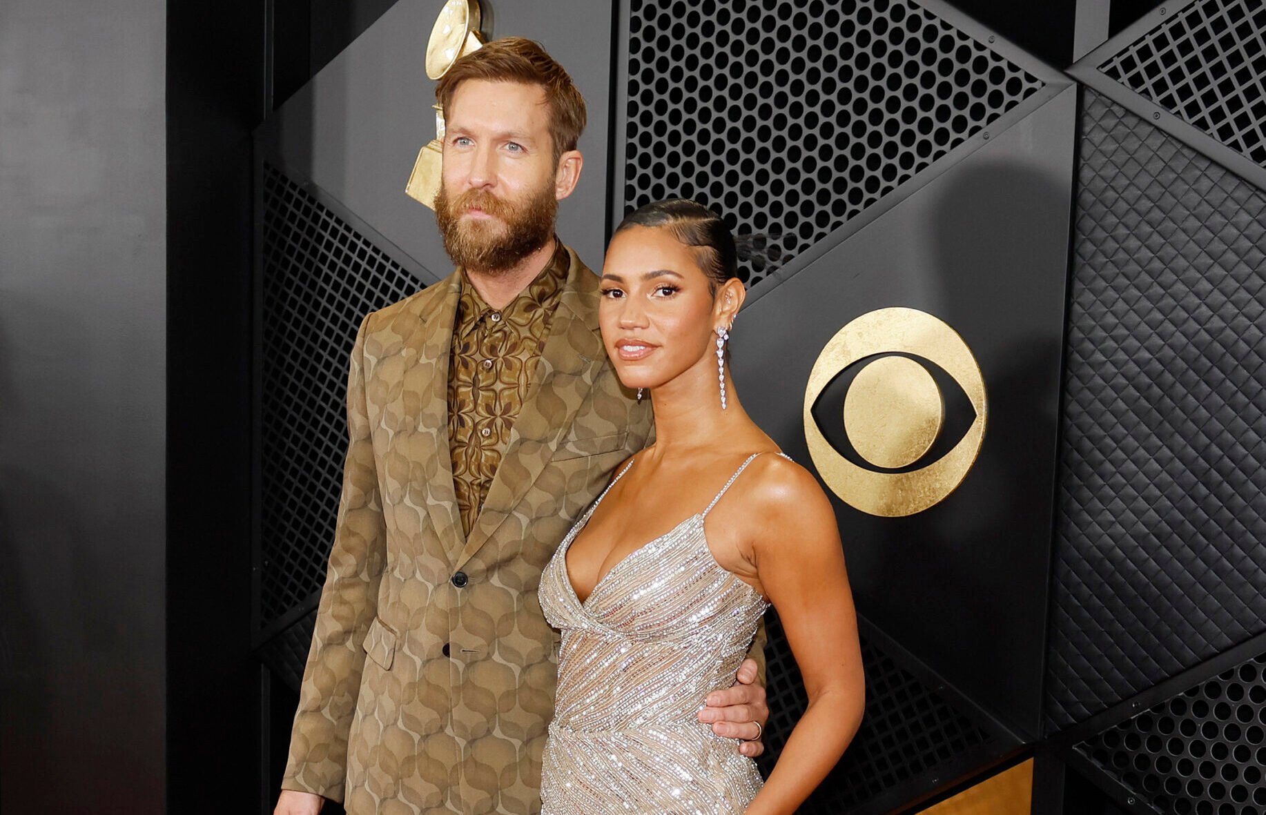 Calvin Harris, left, and Vick Hope arrive on the red carpet for the 66th Annual Grammy Awards at Crypto.com Arena in Los Angeles on Feb. 4, 2024. (Allen J. Schaben/Los Angeles Times/TNS)