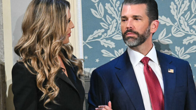 Donald Trump Jr. (R) arrives with Bettina Anderson ahead of US President Donald Trump's address to a joint session of Congress in the House Chamber of the US Capitol in Washington, DC, on March 4, 2025. (Photo by SAUL LOEB / AFP) (Photo by SAUL LOEB/AFP via Getty Images)