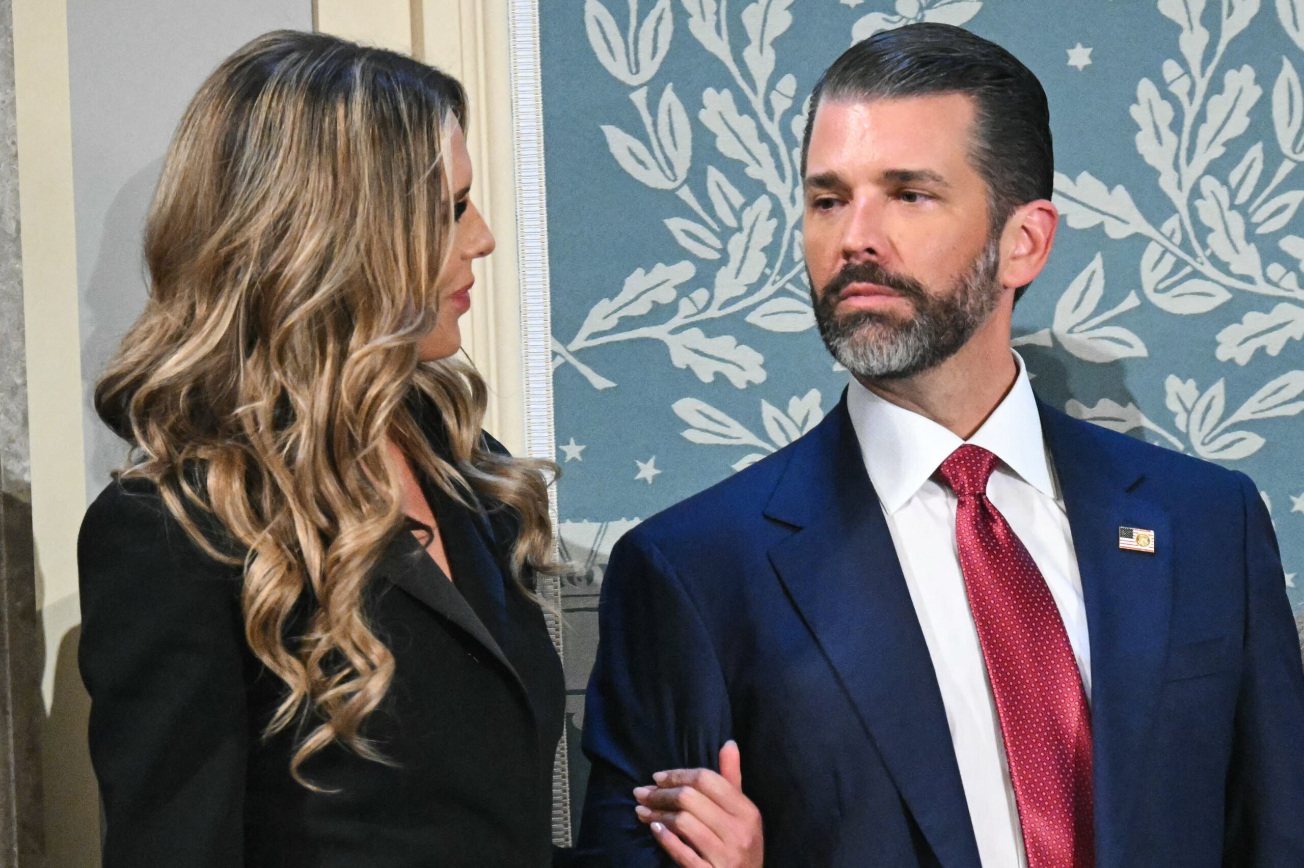 Donald Trump Jr. (R) arrives with Bettina Anderson ahead of US President Donald Trump's address to a joint session of Congress in the House Chamber of the US Capitol in Washington, DC, on March 4, 2025. (Photo by SAUL LOEB / AFP) (Photo by SAUL LOEB/AFP via Getty Images)