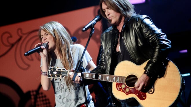 Miley Cyrus, left, performs with her father Billy Ray Cyrus on Jan. 19, 2009, in Washington, D.C. (Brendan Smialowski/Getty Images/TNS)
