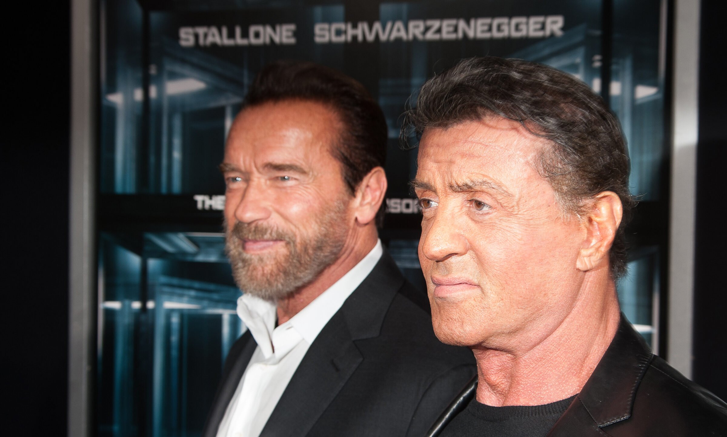 Arnold Schwarzenegger, left, and Sylvester Stallone attend the "Escape Plan" New York premiere at Regal E-Walk on Oct. 15, 2013, in New York City. (Dave Kotinsky/Getty Images/TNS)