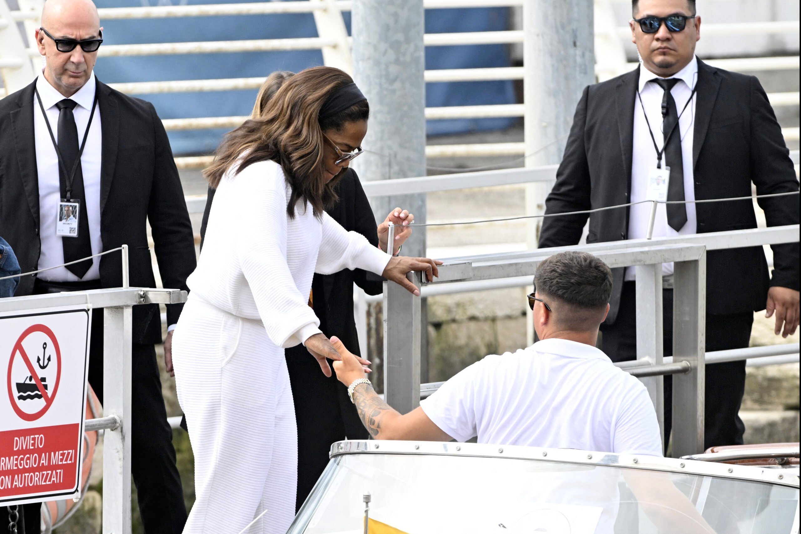 US talk show host Oprah Winfrey prepares to board a taxi boat at Venice Marco Polo airport ahead of Jeff Bezos' wedding on June 26, 2025. Celebrities in superyachts sail into Venice this week for the three-day wedding party of Amazon tycoon Jeff Bezos and Lauren Sanchez, despite irate locals who say the UNESCO city is no billionaire's playground. The tech magnate and journalist have reportedly invited about 200 guests to their multi-million dollar nuptials in the Italian city, which are expected to kick off on June 26 and end Saturday with a ceremony at a secret location. (Photo by ANDREA PATTARO / AFP) (Photo by ANDREA PATTARO/AFP via Getty Images)