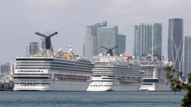 Carnival Cruise Line's ships Sunrise, left, and Vista, center, along with the MSC Meraviglia, are docked at the Port of Miami on Feb. 18, 2021. Sunrise, formerly named Triumph, experienced an emergency in 2013 when the ship, full of travelers, lost power for four days while returning to Texas. (Susan Stocker/South Florida Sun Sentinel/TNS)