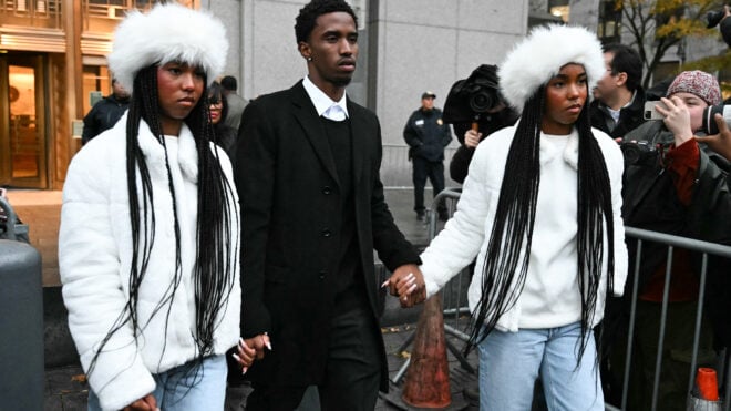 Sean "Diddy" Combs' children King Combs, center, and twins Jessie and D'Lila Combs hold hands as they leave the federal court after his bail hearing on Nov. 22, 2024, in New York City. (Timothy A. Clary/AFP via Getty Images/TNS)