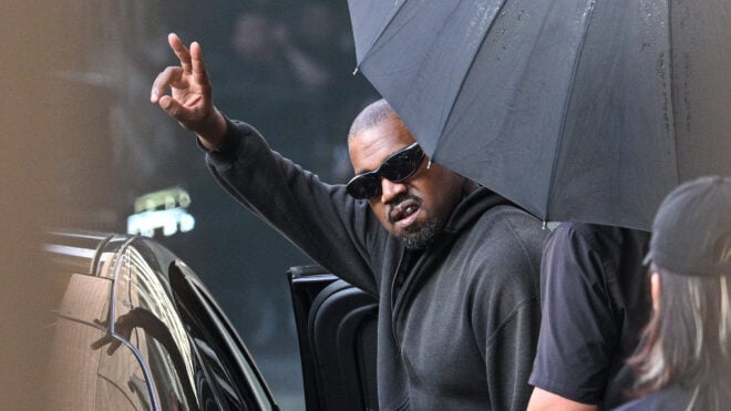 Kanye West gestures upon arriving at Shanghai Pudong International Airport on July 11, 2025. (Hector Retamal/AFP via Getty Images/TNS)