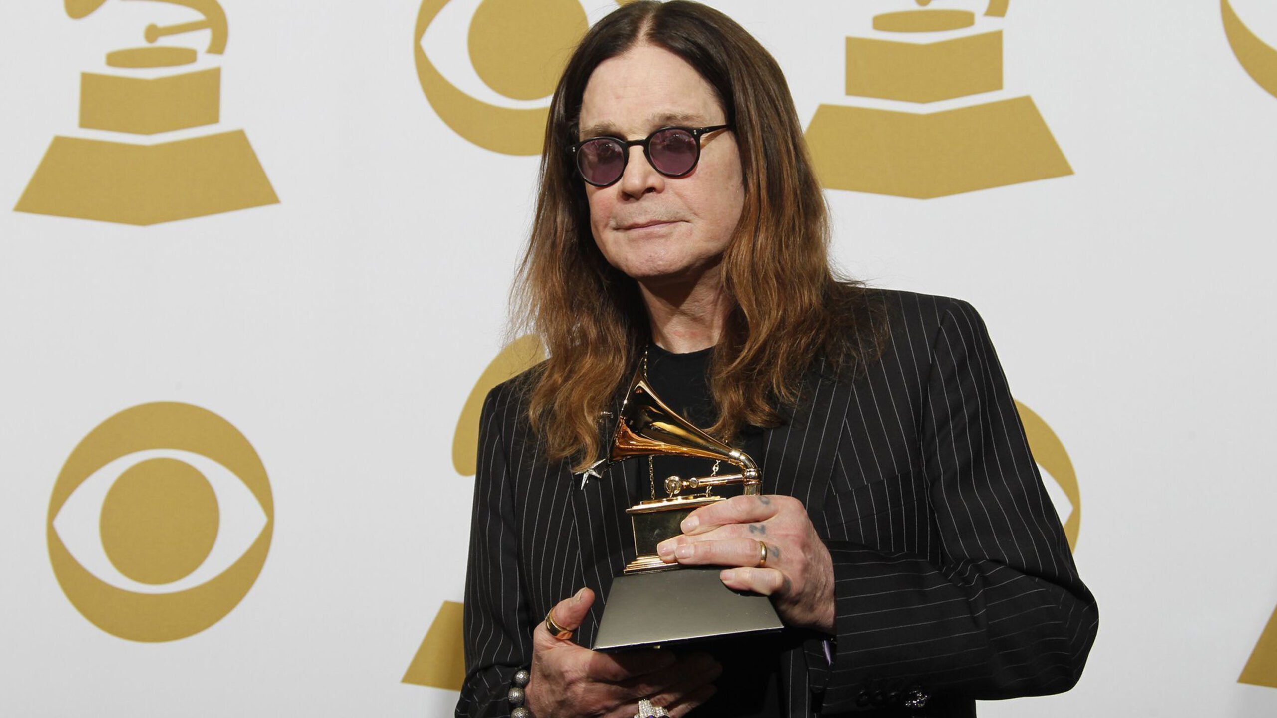 Ozzy Osbourne with Black Sabbath’s 2014 Grammy Award for best metal performance