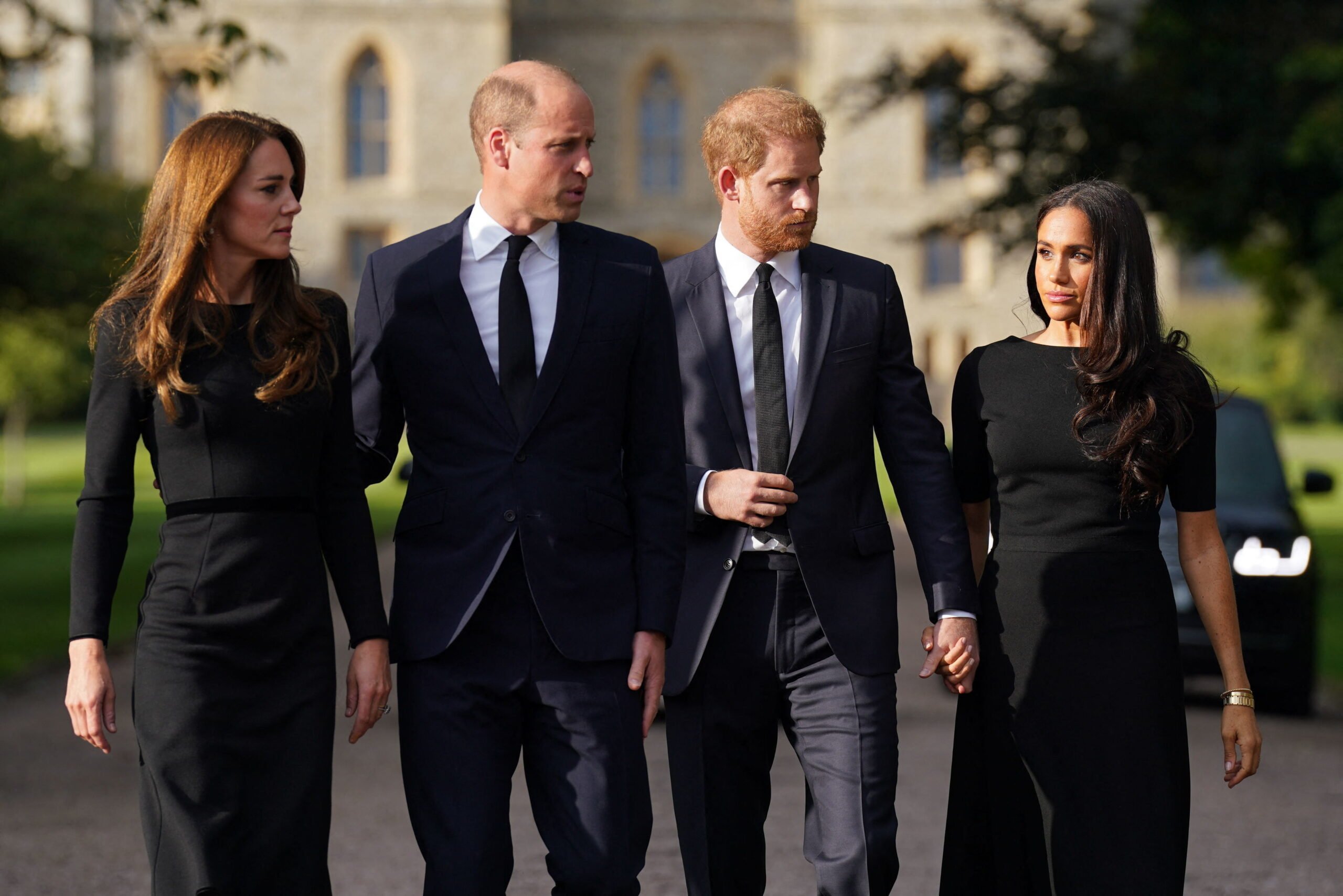 TOPSHOT - (L-R) Britain's Catherine, Princess of Wales, Britain's Prince William, Prince of Wales, Britain's Prince Harry, Duke of Sussex, and Meghan, Duchess of Sussex on the long Walk at Windsor Castle on September 10, 2022, before meeting well-wishers. King Charles III pledged to follow his mother's example of "lifelong service" in his inaugural address to Britain and the Commonwealth on Friday, after ascending to the throne following the death of Queen Elizabeth II on September 8. (Photo by Kirsty O'Connor / POOL / AFP) (Photo by KIRSTY O'CONNOR/POOL/AFP via Getty Images)