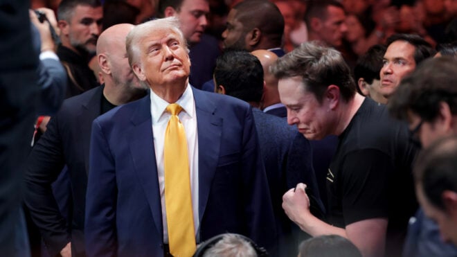 MIAMI, FLORIDA - APRIL 12: U.S. President Donald Trump prepares to watch the Ultimate Fighting Championship with Elon Musk at the Kaseya Center on April 12, 2025 in Miami, Florida. The Trump administration issued a rule late Friday that spared smartphones, computers, semiconductors, and other electronics from some of the tariffs they have enacted. (Photo by Joe Raedle/Getty Images)