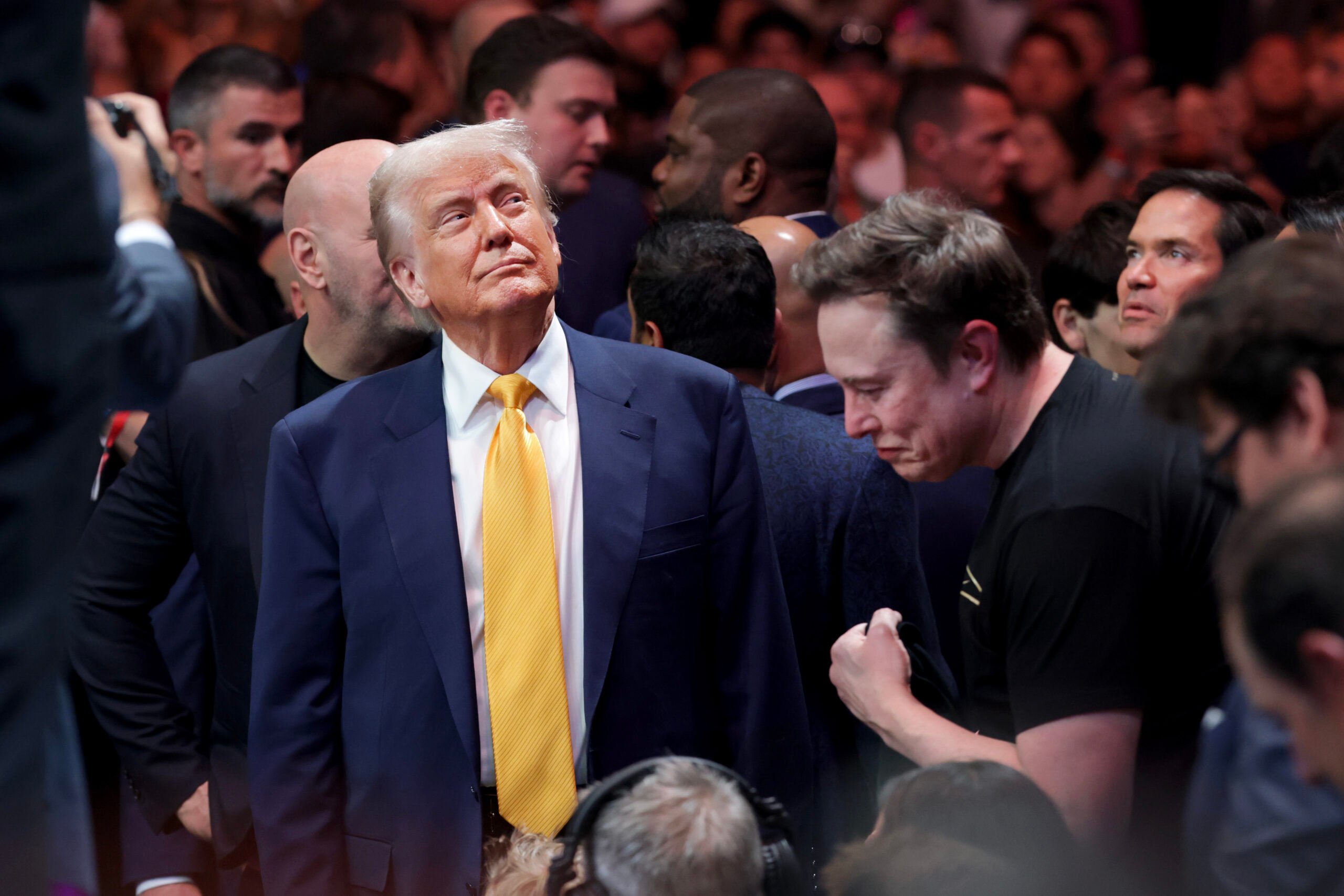 MIAMI, FLORIDA - APRIL 12: U.S. President Donald Trump prepares to watch the Ultimate Fighting Championship with Elon Musk at the Kaseya Center on April 12, 2025 in Miami, Florida. The Trump administration issued a rule late Friday that spared smartphones, computers, semiconductors, and other electronics from some of the tariffs they have enacted. (Photo by Joe Raedle/Getty Images)
