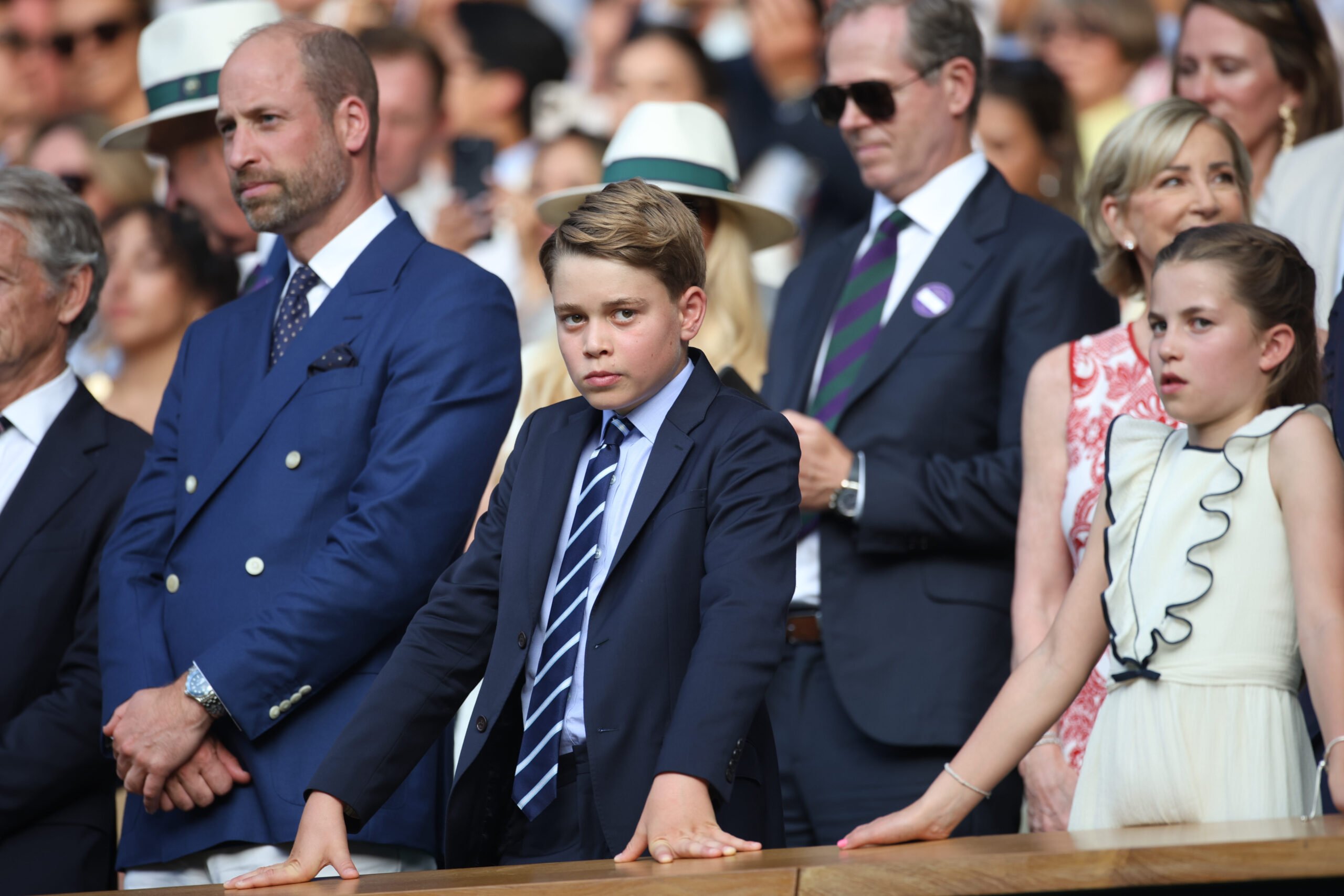 LONDON, ENGLAND - JULY 13: Prince William, Prince of Wales, Prince George of Wales and Princess Charlotte of Wales, watch the presentation ceremony of the Gentlemen's Singles Final on Centre Court during the Wimbledon Lawn Tennis Championships at the All England Lawn Tennis and Croquet Club at Wimbledon on July 13th, 2025, in London, England. (Photo by Tim Clayton/Getty Images)