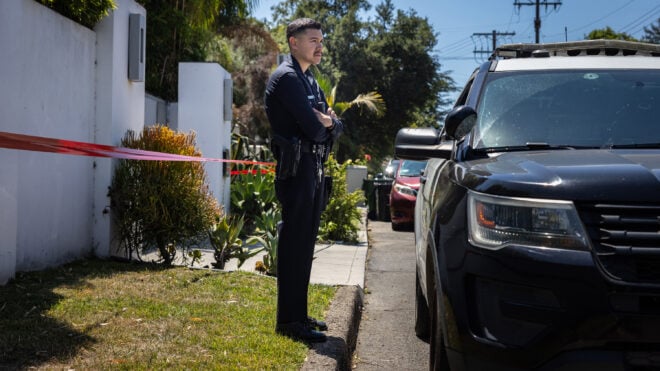 Los Angeles Police Department officials on Tuesday, July 15, 2025, secure the home where Robin Kaye, an "American Idol" music supervisor, and her husband, Thomas Deluca, were found dead in Encino, California. (Jason Armond/Los Angeles Times/TNS)