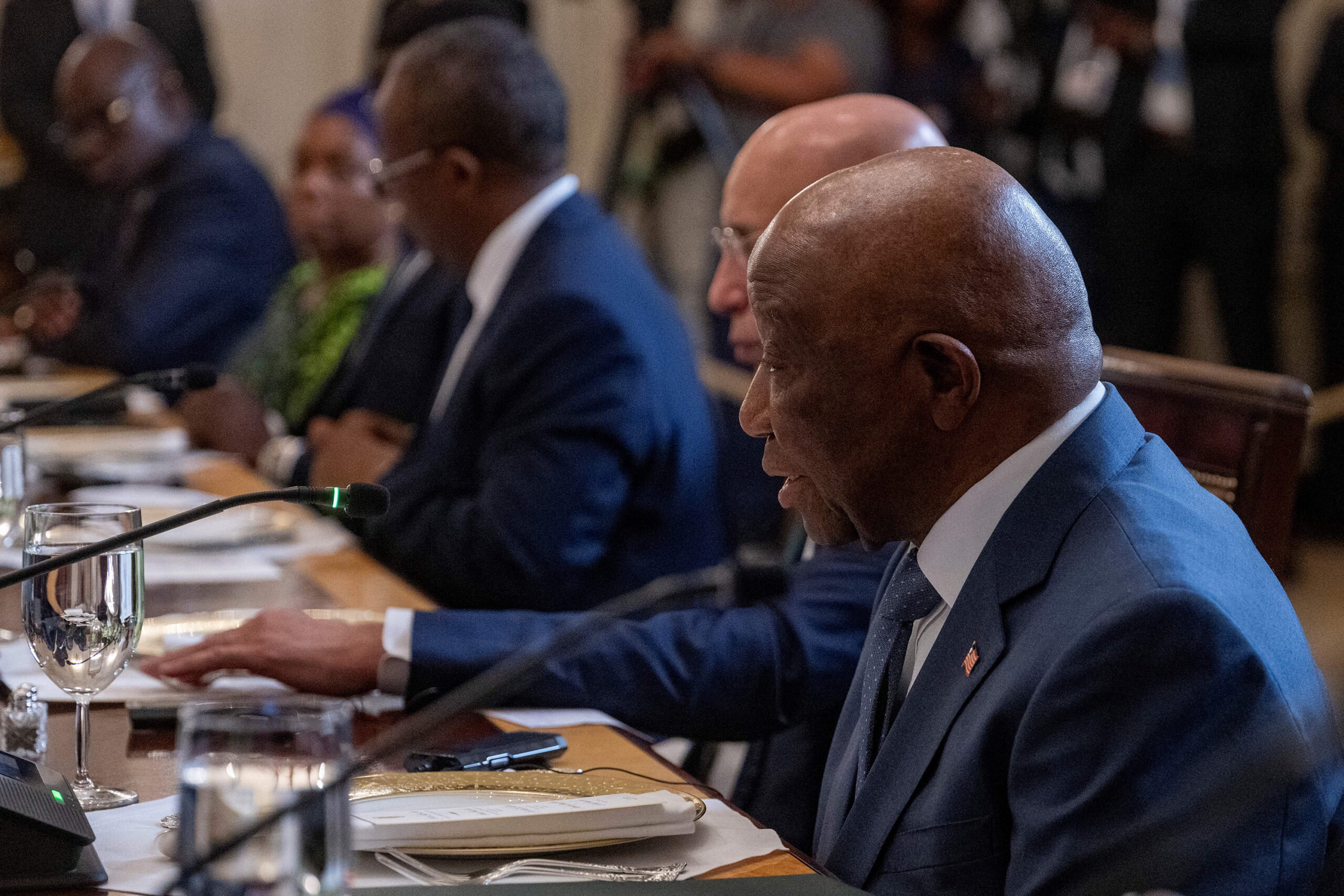 Liberian President Joseph Boakai (right) speaks during a multilateral lunch with U.S. President Donald Trump and visiting African Leaders in the State Dining Room of the White House in Washington, D.C., on Wednesday, July 9, 2025. Trump is hosting five leaders from West Africa Wednesday for a White House summit aimed at fostering trade to counter the growing regional influence of Russia and China. (Jim Watson/AFP/Getty Images/TNS)
