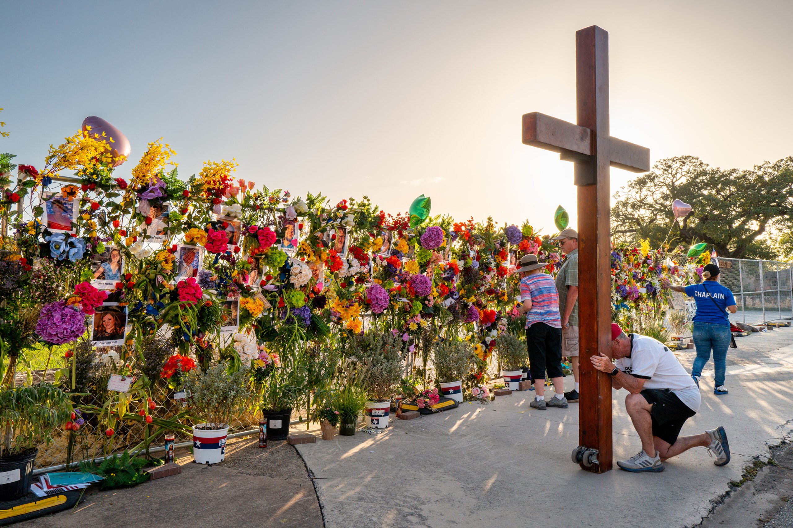 Community residents grieve and pay their respects at a memorial on July 10, 2025, in Kerrville, Texas. Last Friday, heavy rainfall caused severe flash flooding throughout the hill country and various cities along the Guadalupe River. (Brandon Bell/Getty Images/TNS)