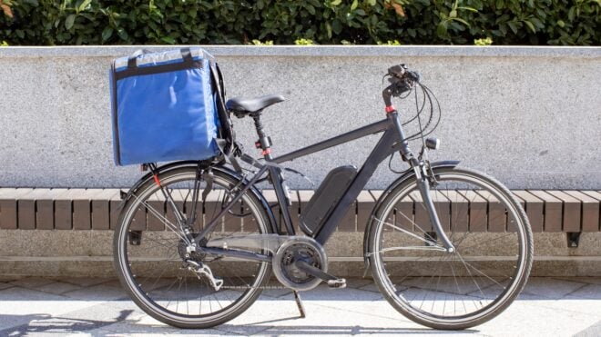 e-bike with food delivery on the back.