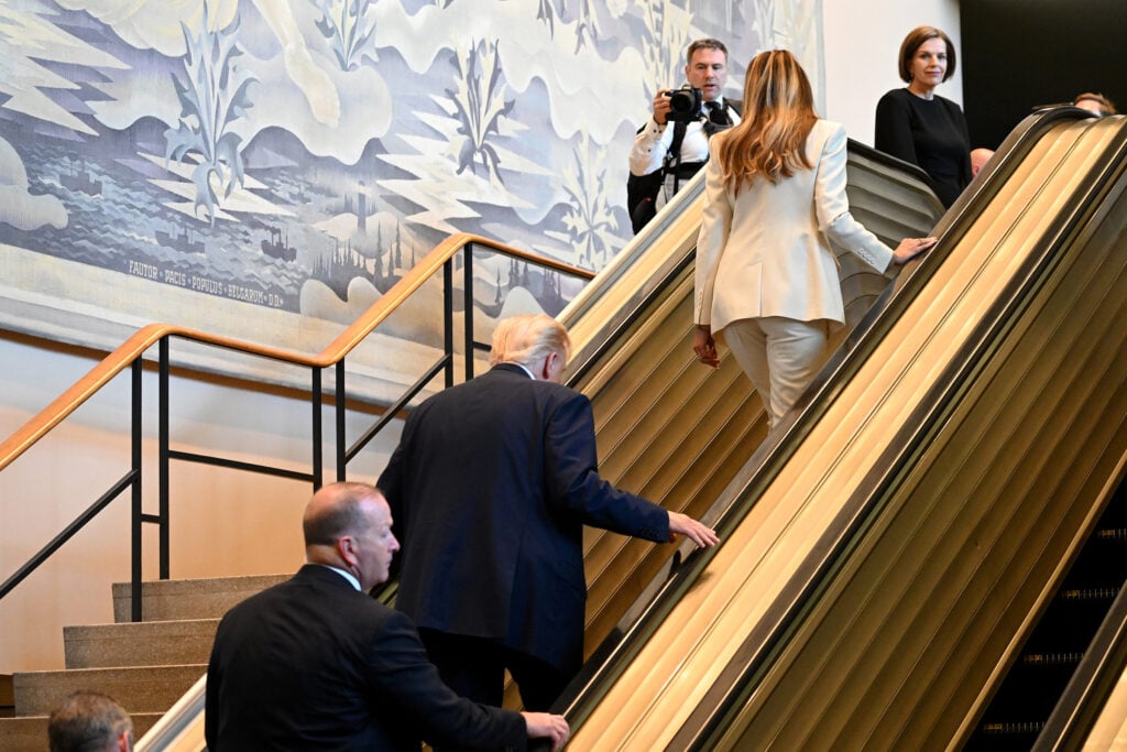 Donald Trump and Melania going up the escalator at the UN