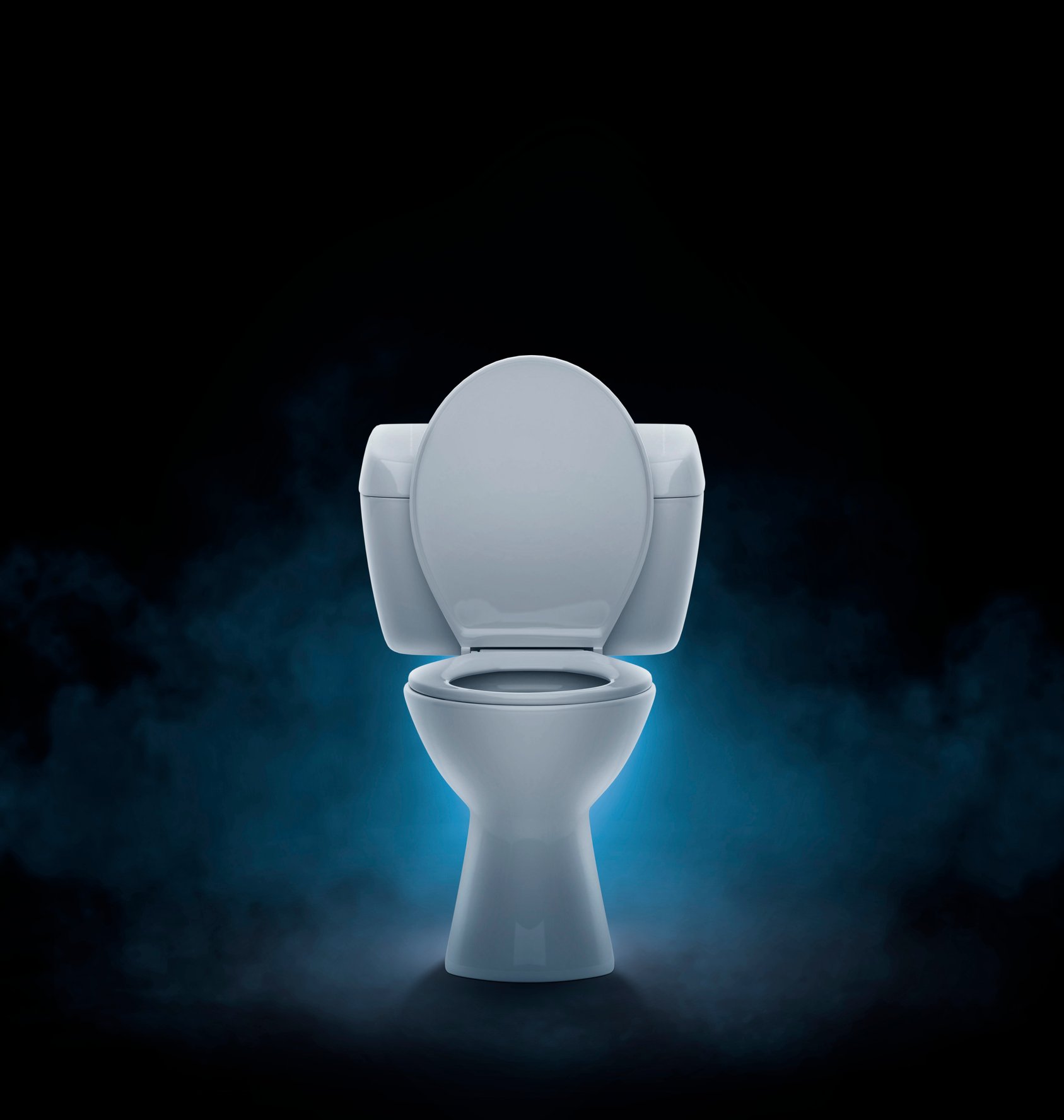 Toilet bowl on black background with smoke