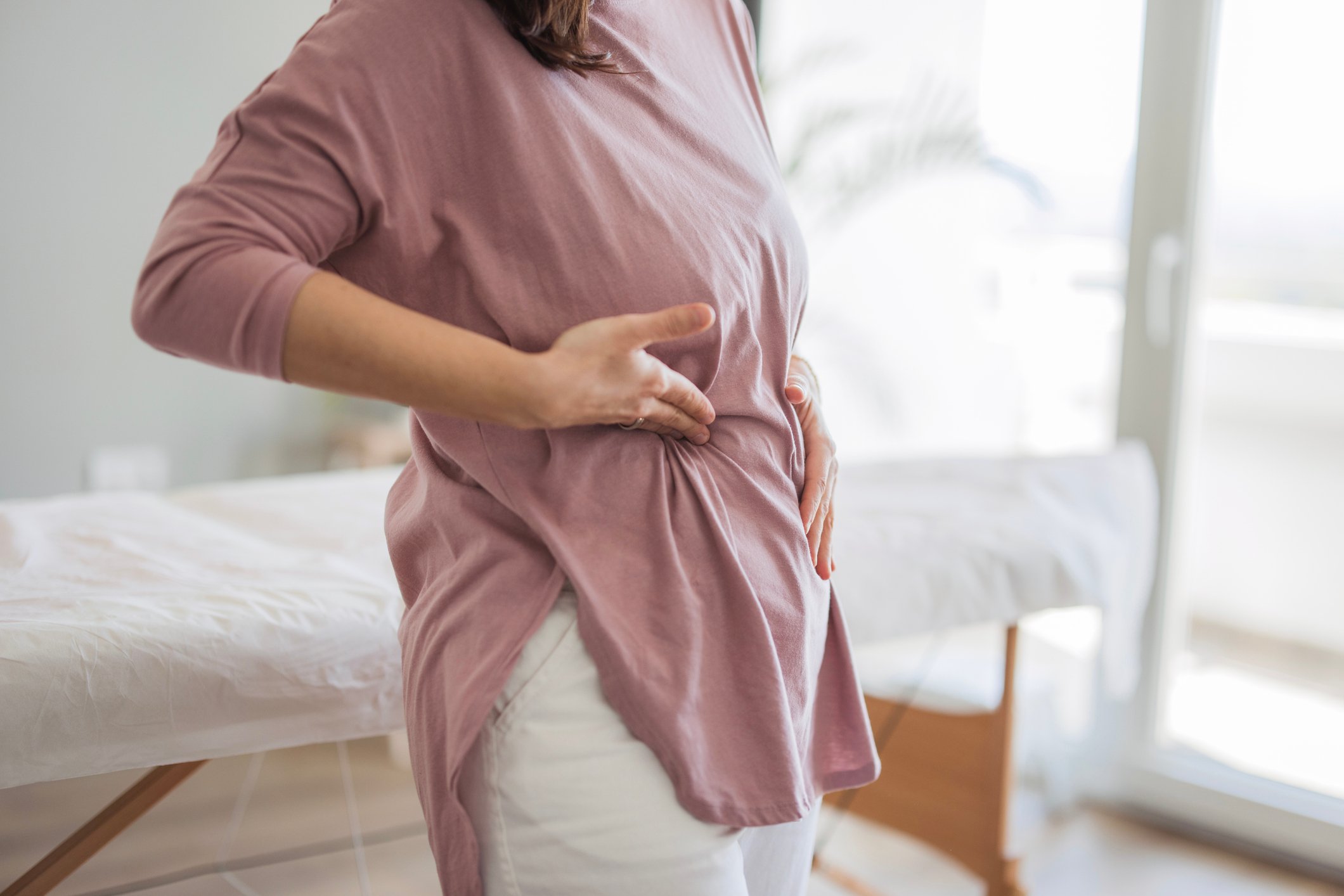 Woman touching her stomach