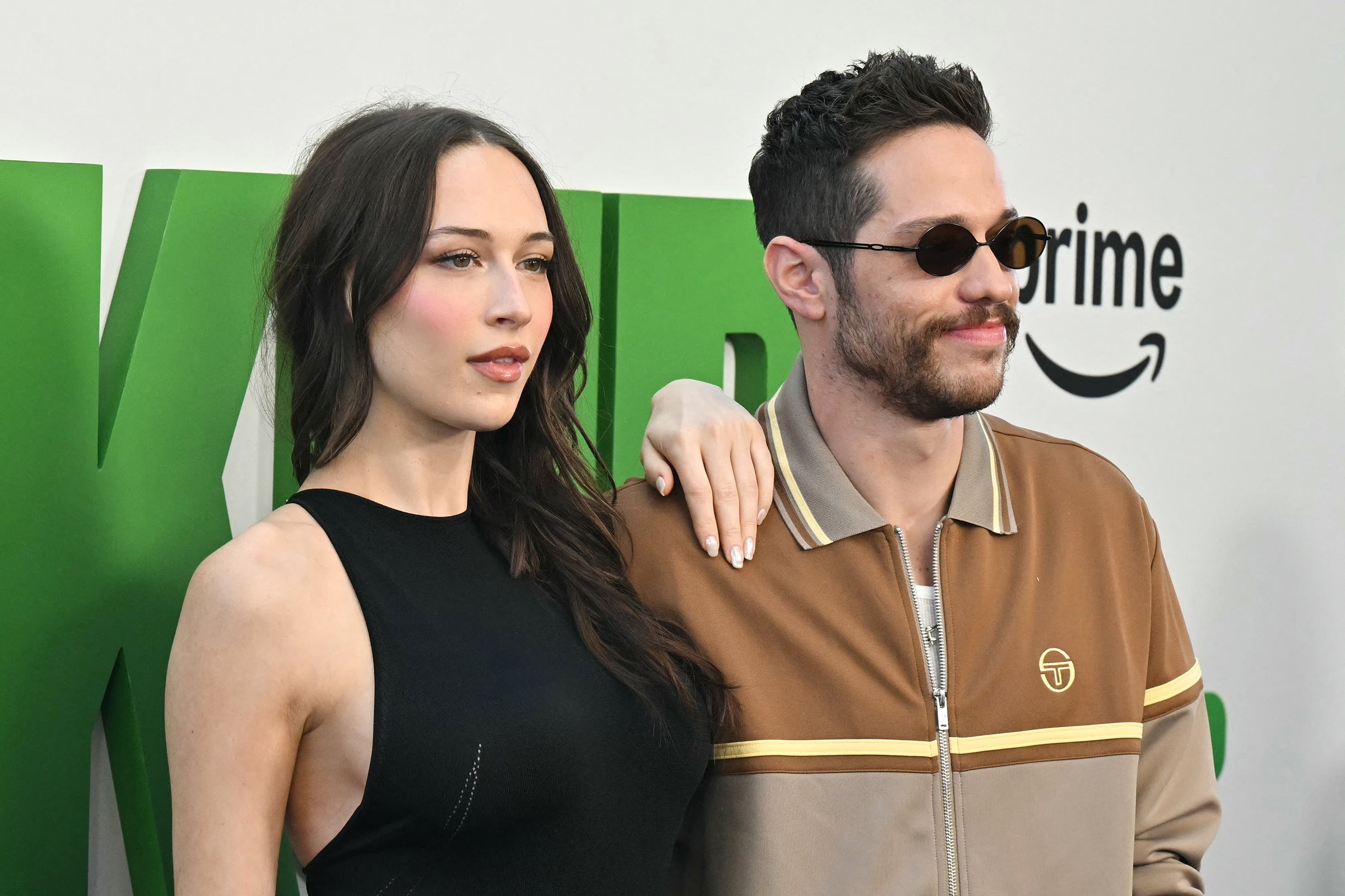 Pete Davidson (right) and girlfriend Elsie Hewitt attend the world premiere of "The Pickup" at the Regal LA Live in Los Angeles on July 27, 2025.