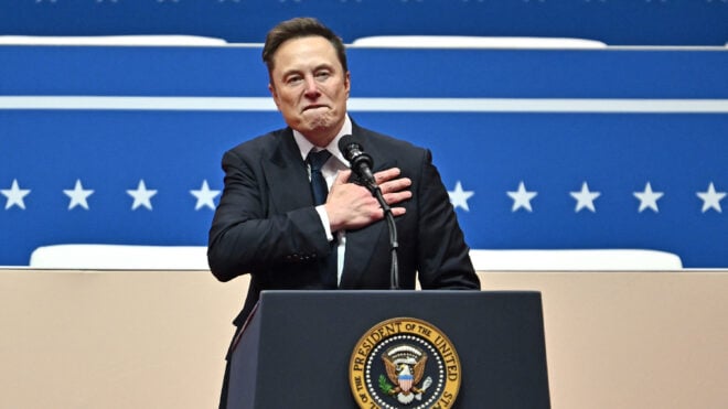Tesla and SpaceX CEO Elon Musk gestures as he speaks during the inaugural parade inside Capitol One Arena, in Washington, D.C., on Monday, Jan. 20, 2025.