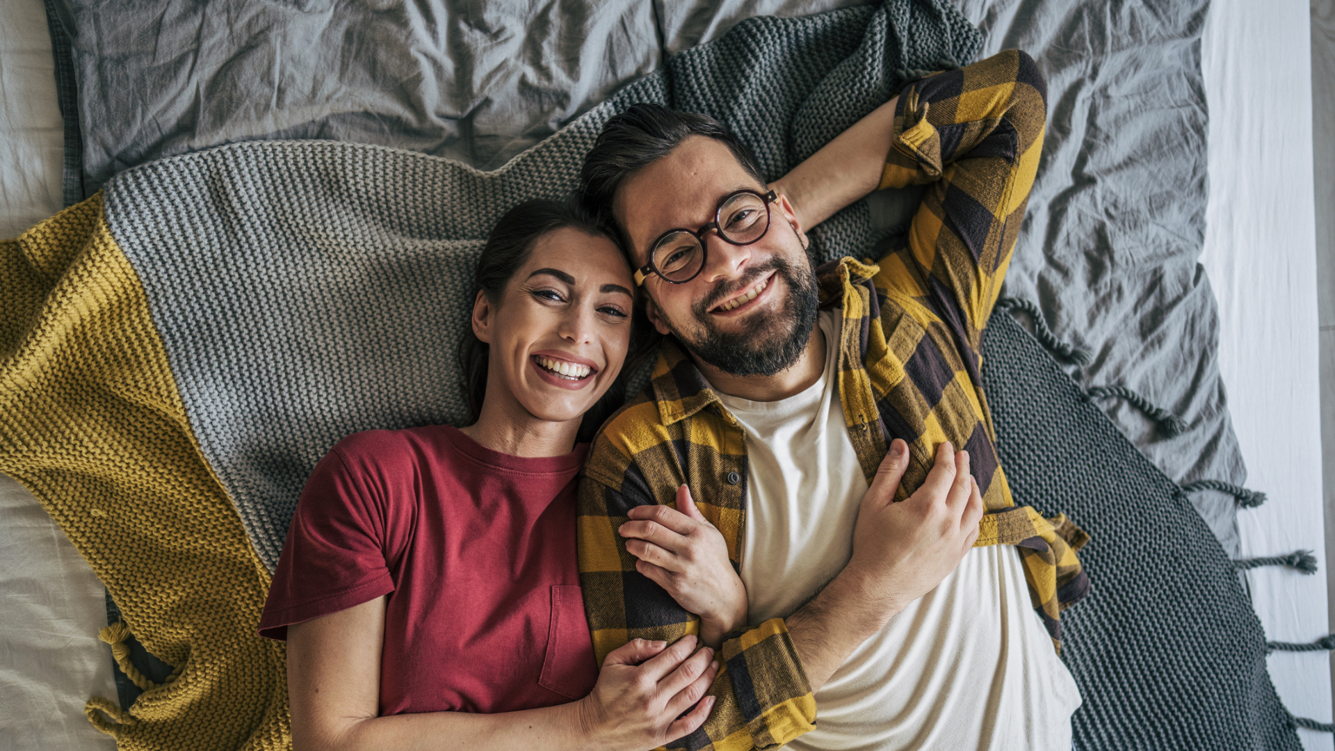 happy couple in bed