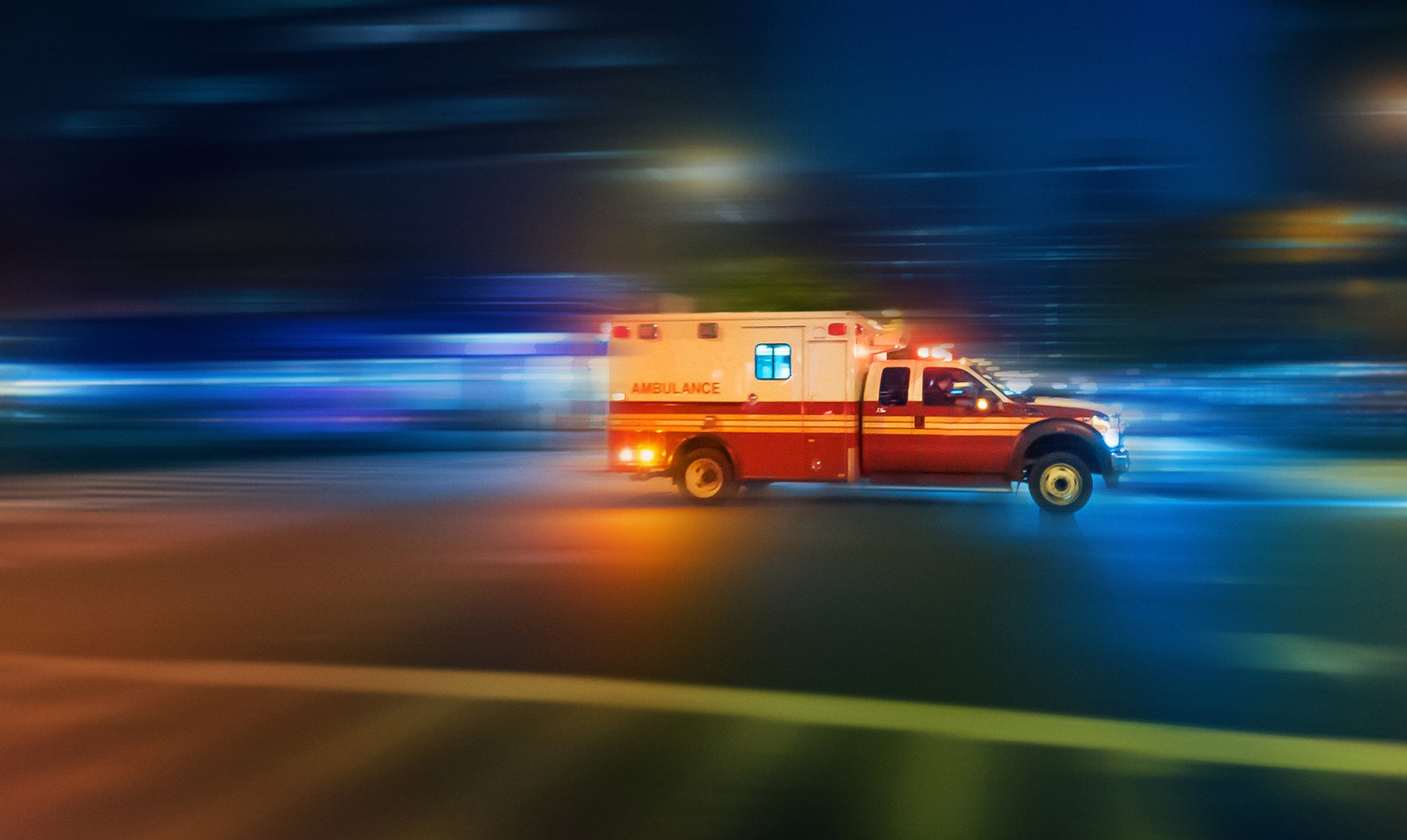 Ambulance speeding at night on an urgent call