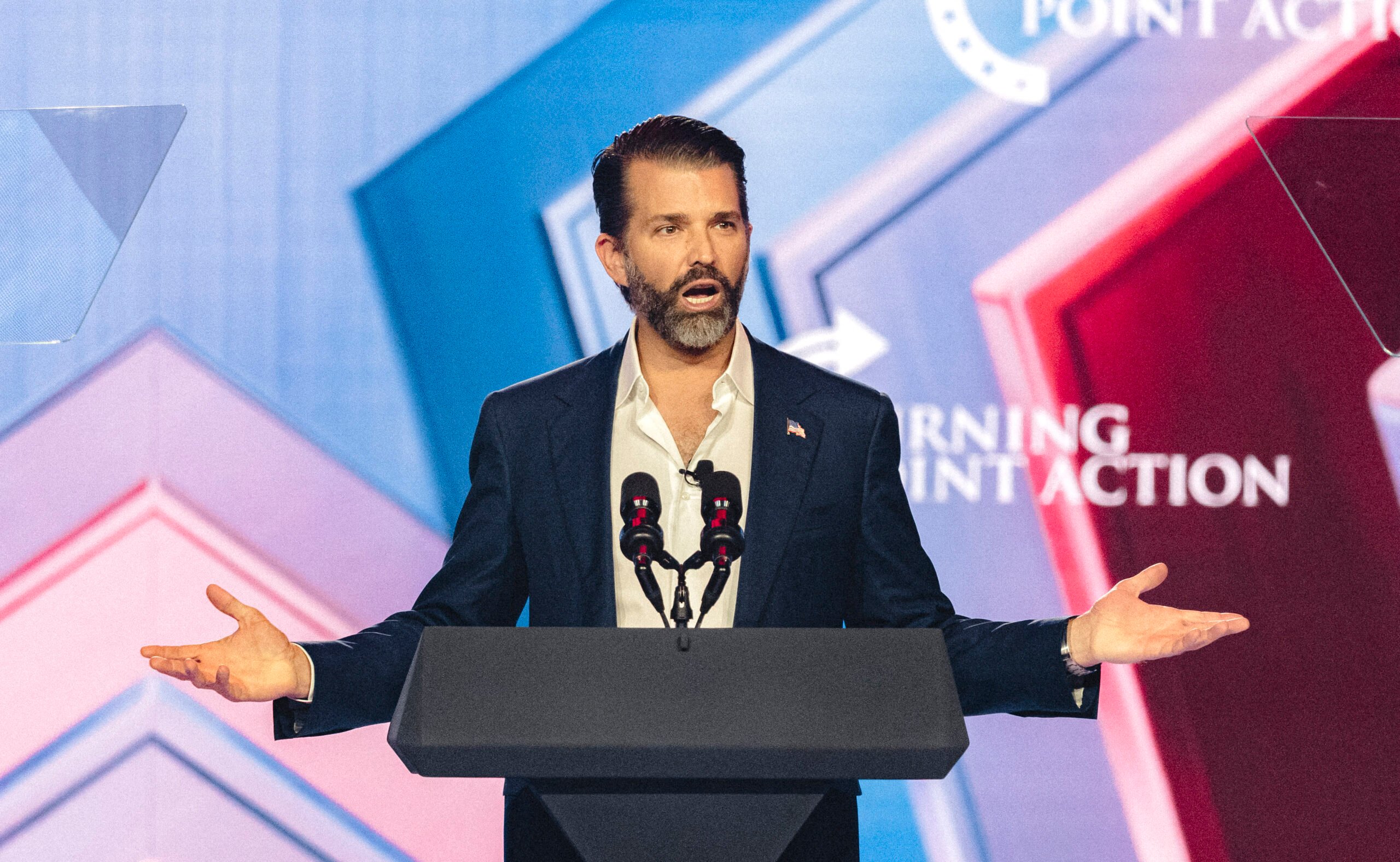 Donald Trump Jr. speaks on stage during Turning Point's annual AmericaFest conference
