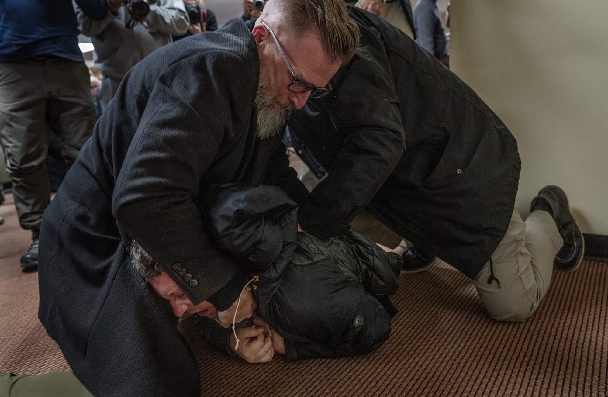 A man is tackled to the ground