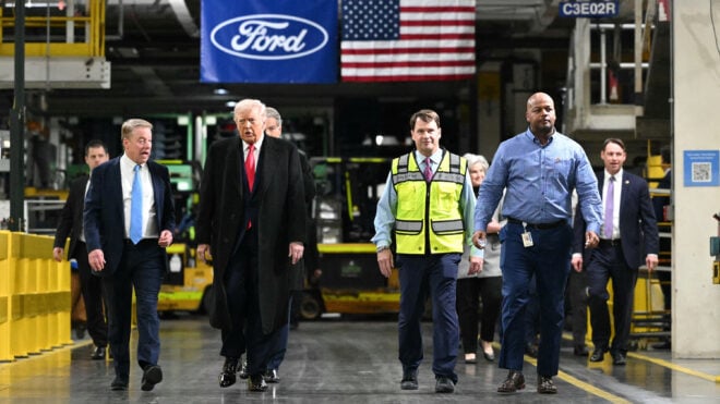 U.S. President Donald Trump speaks with Ford executive chairman Bill Ford,