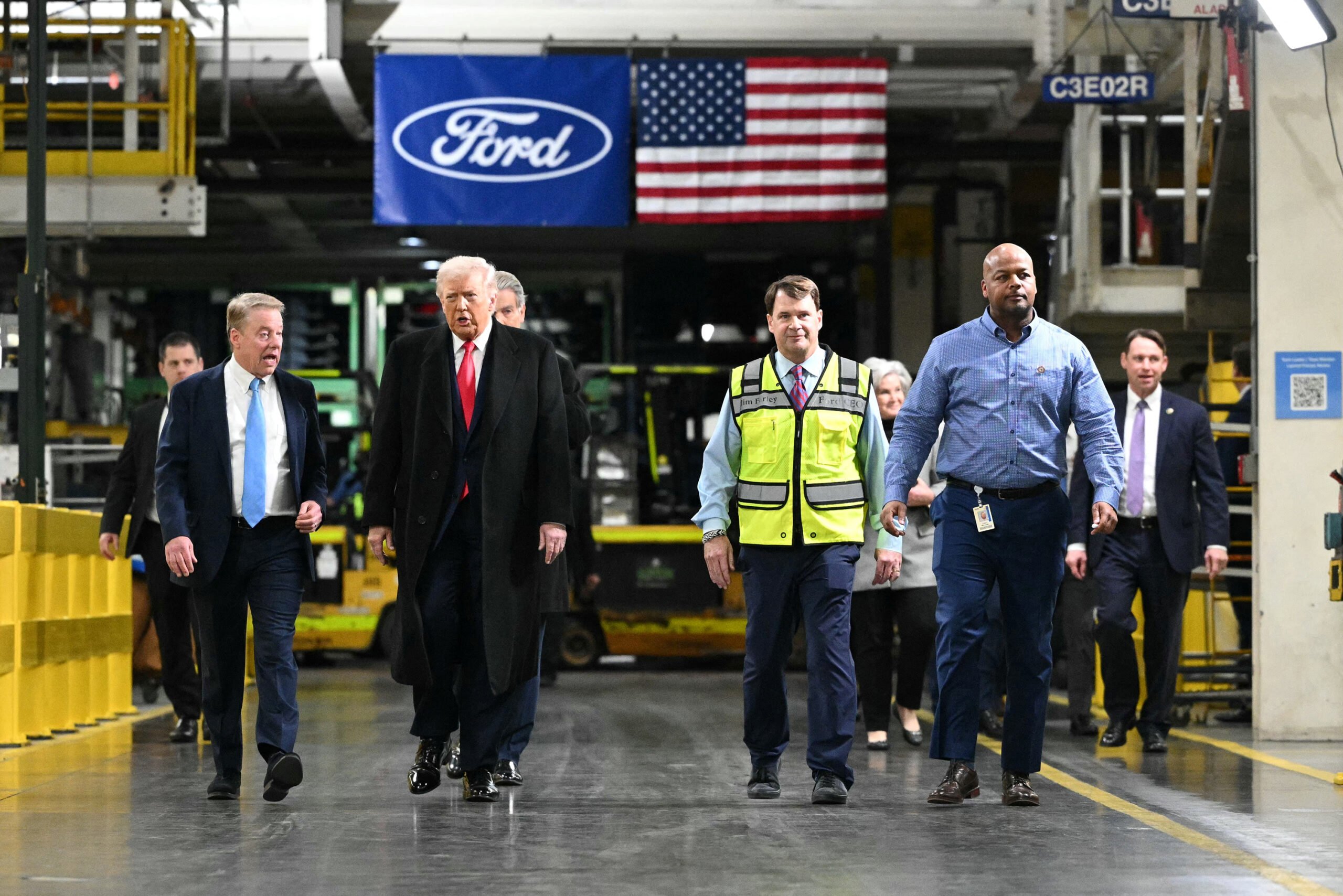 U.S. President Donald Trump speaks with Ford executive chairman Bill Ford,