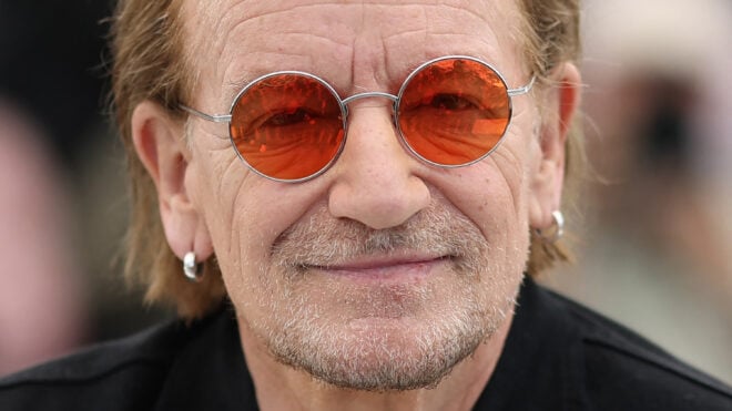 Irish singer Bono of U2 poses during a photocall for the film "Bono: