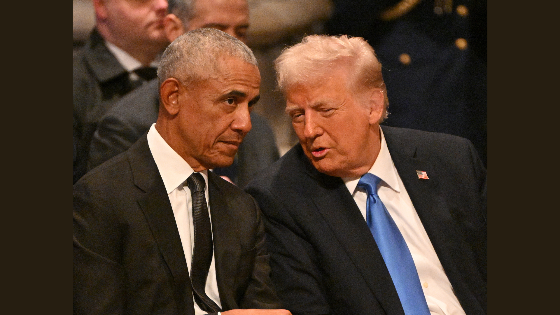 Former US President Barack Obama speaks with President-elect Donald Trump