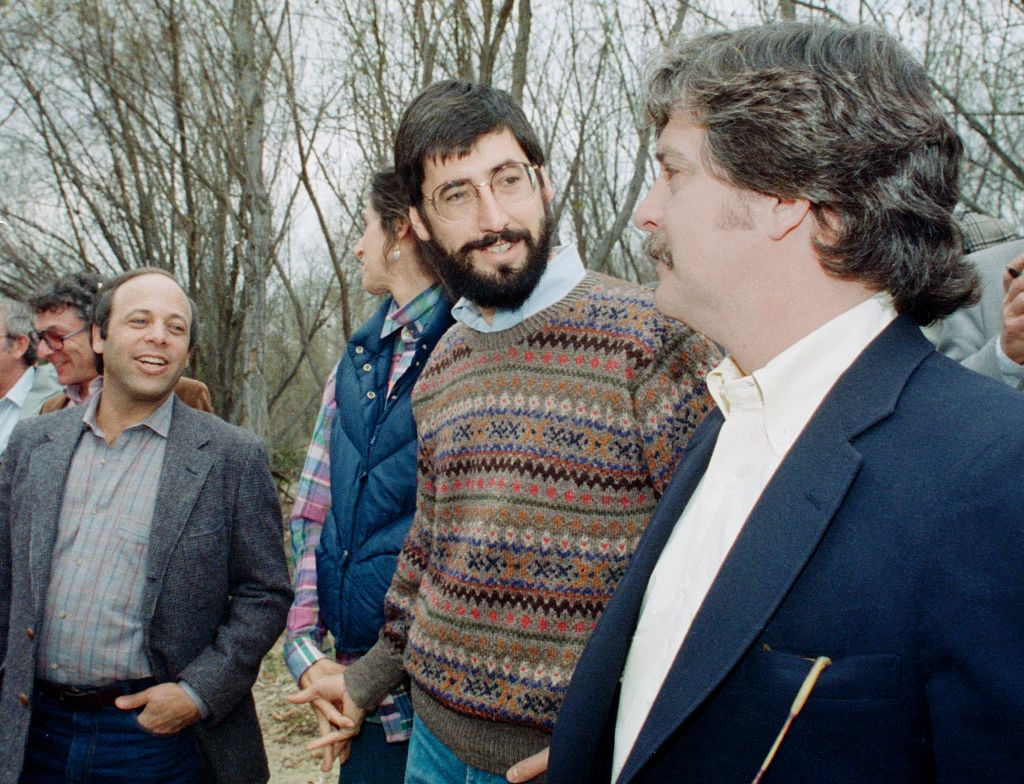 SAUGUS, CALIFORNIA - FEBRUARY 10 : Director John Landis, talks with representative after a Los Angeles County Fire Department helicopter flew a similar route above the Santa Clara River where a 1982 helicopter filming accident killed actor Vic Morrow and two children by a disabled helicopter, February 10, 1987 in Saugus, California. Saugus is located just North of Los Angeles.
