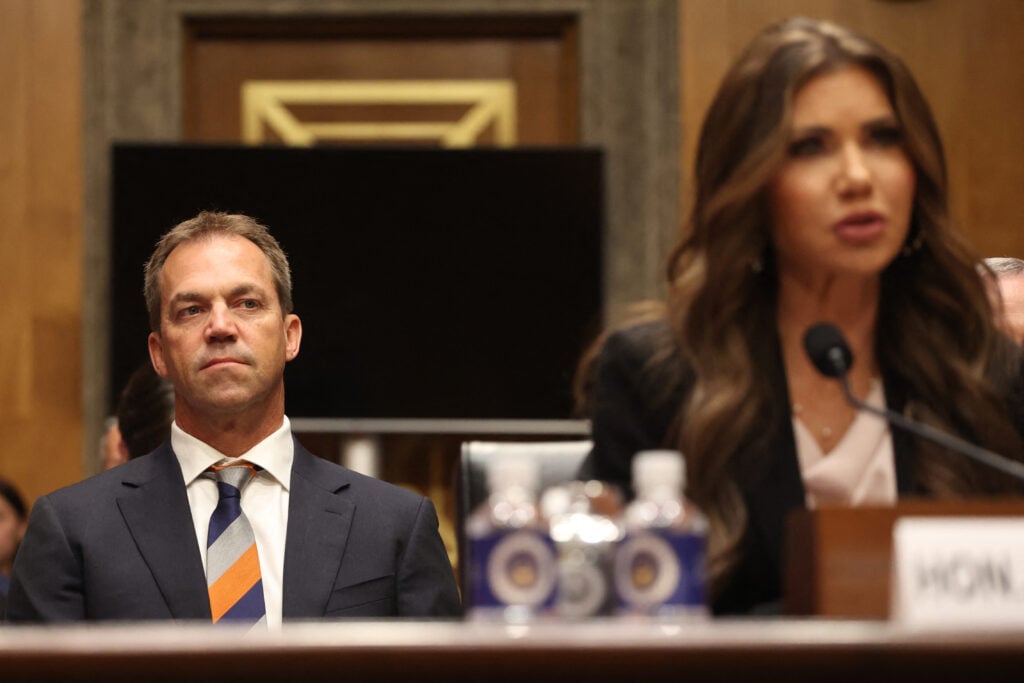 Bryon Noem (L), husband of US Secretary of Homeland Security Kristi Noem (R), listens as Secretary Noem testifies before the Senate Committee on Homeland Security and Governmental Affairs to examine the President's proposed budget request for fiscal year 2026 for the Department of Homeland Security, on Capitol Hill in Washington, DC, May 20, 2025