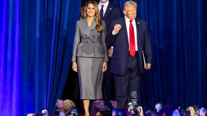 President Donald Trump arrives to his election night party alongside his wife, Melania Trump, and his son, Barron Trump